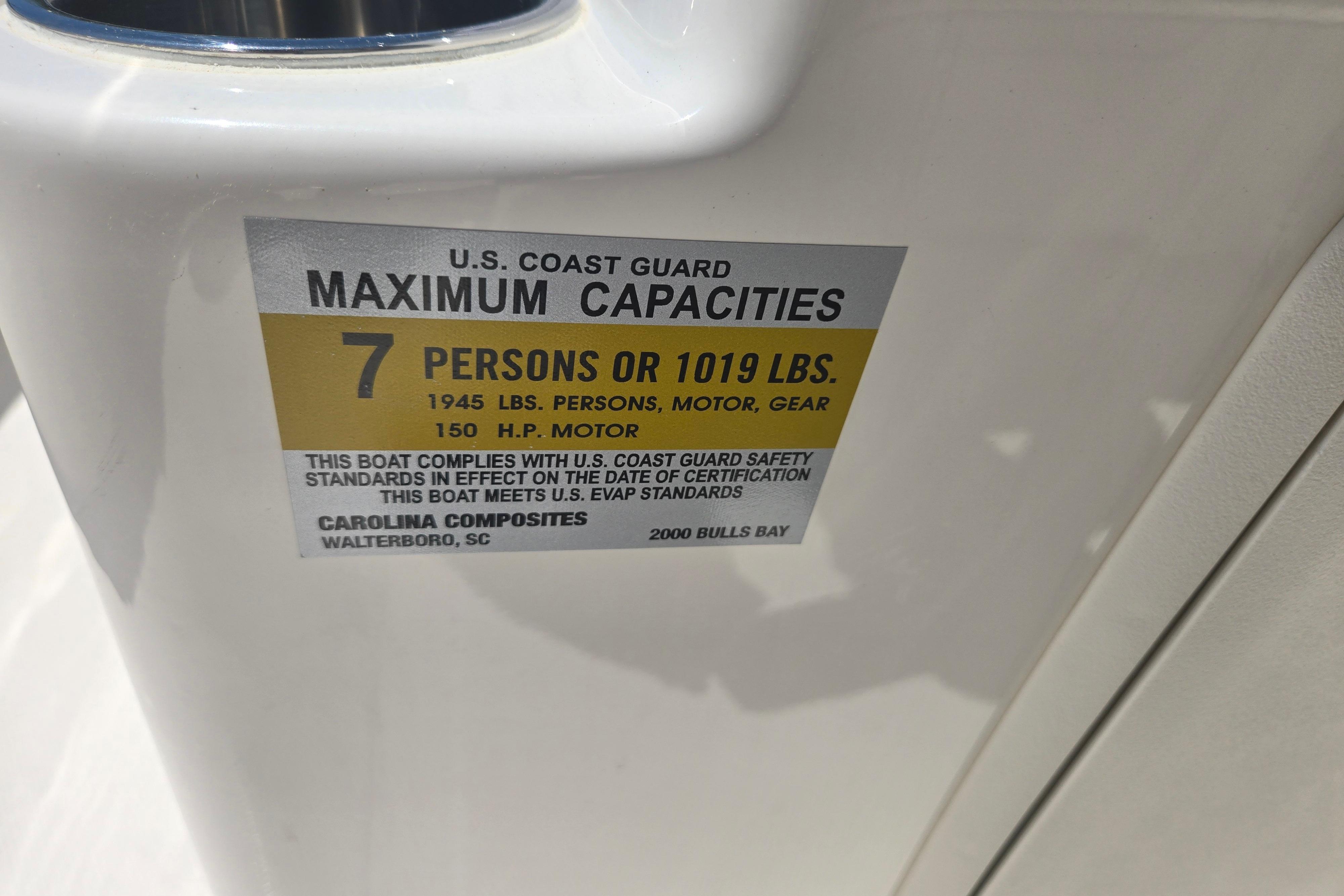 U.S. Coast Guard capacity label on 2026 Bulls Bay 2000 boat, 7 persons or 1019 lbs.