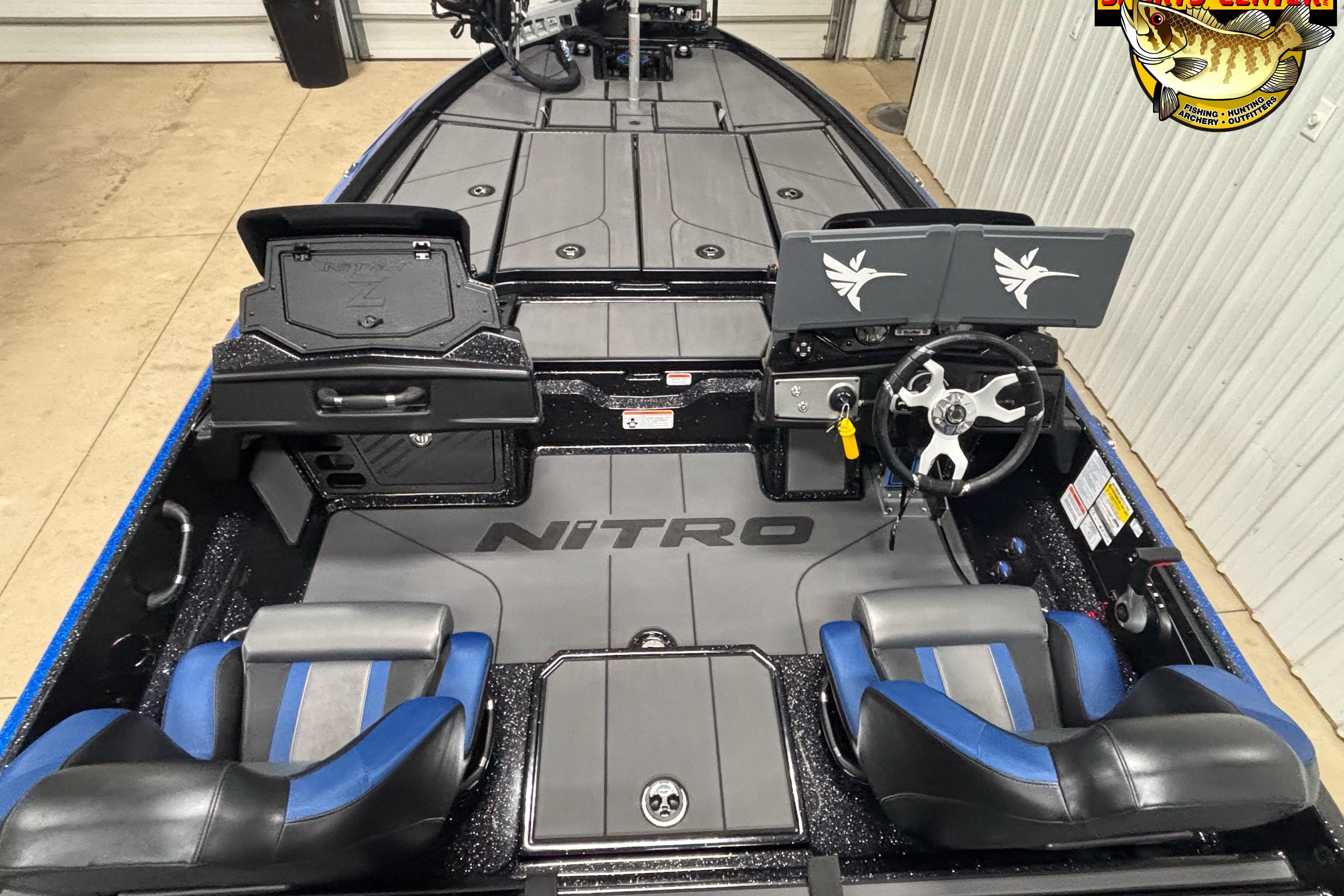 2026 Nitro Z21 XL boat interior with dual seats, steering wheel, and storage compartments.