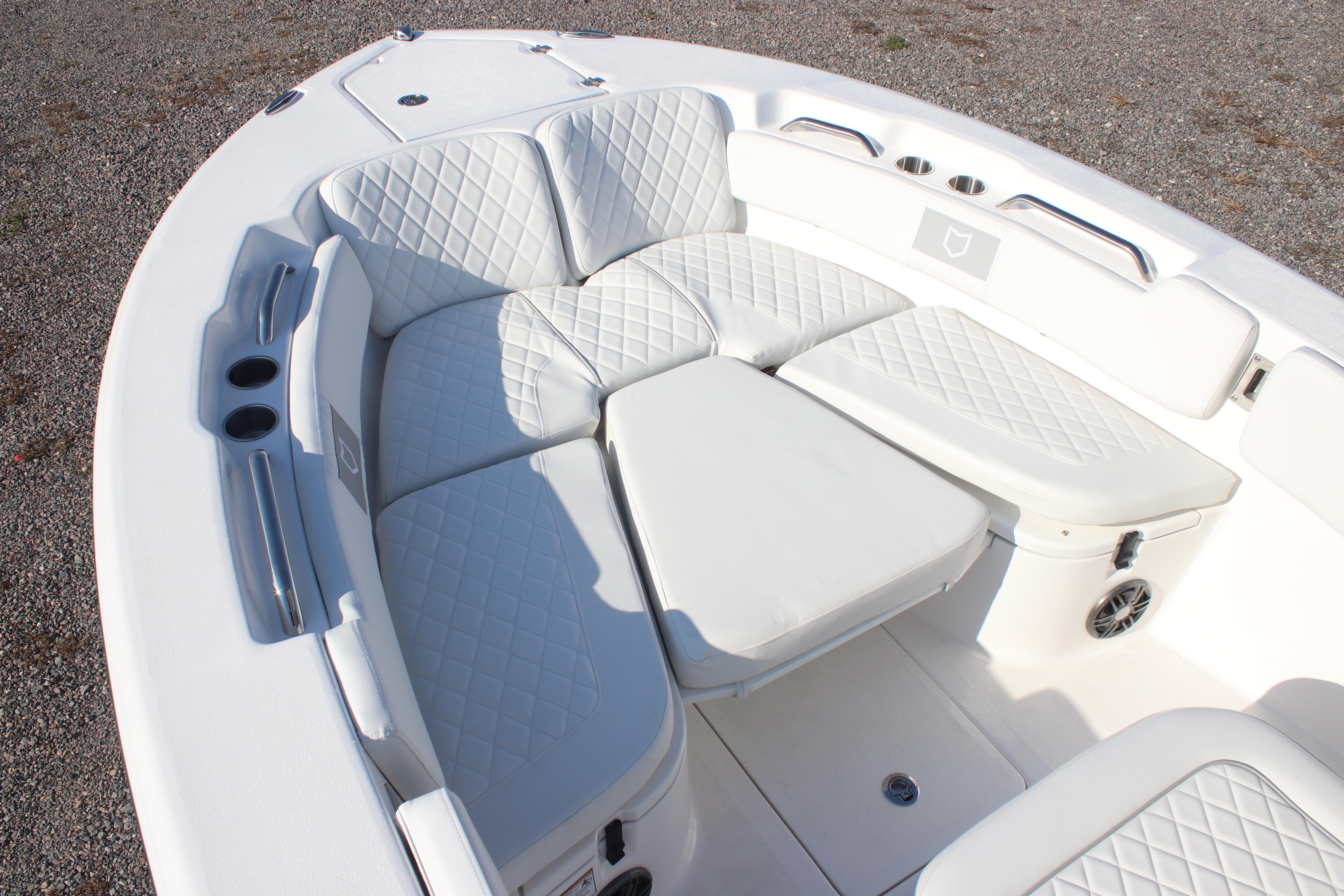 2026 Sea Fox 248 Commander boat with luxurious white seating and cup holders.