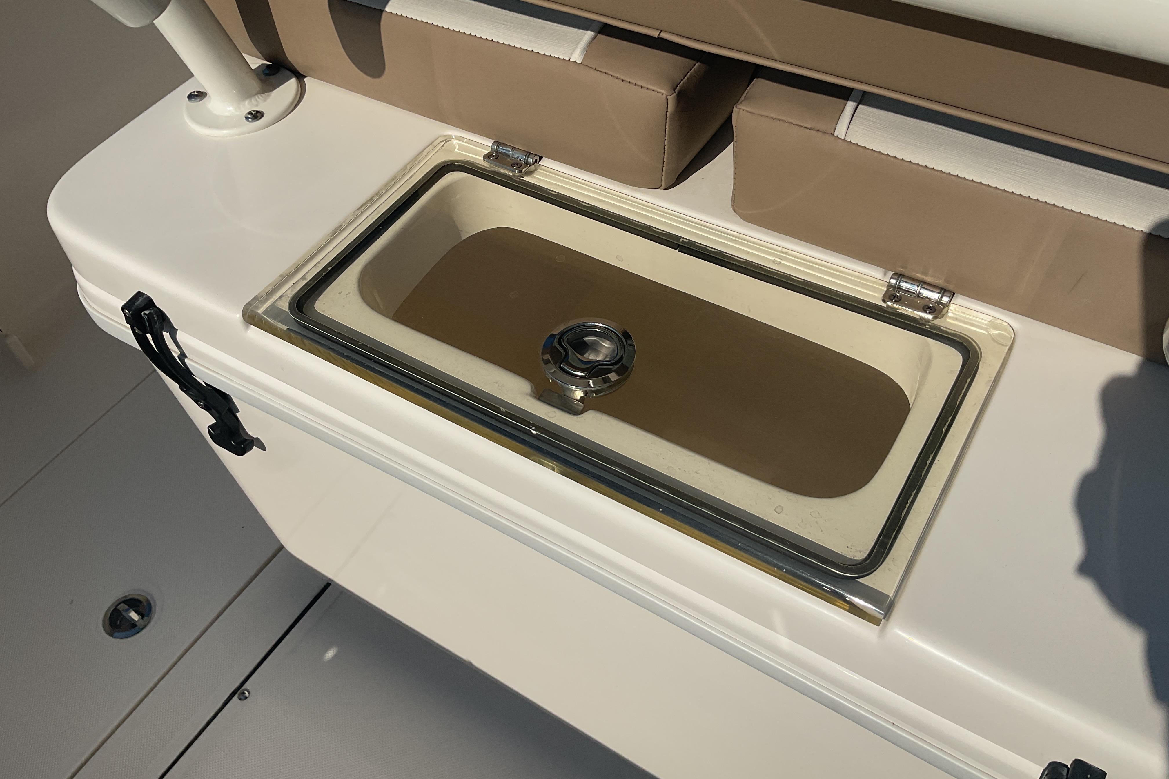 2023 Sea Born SX239 Offshore boat with built-in storage compartment and cushioned seating.