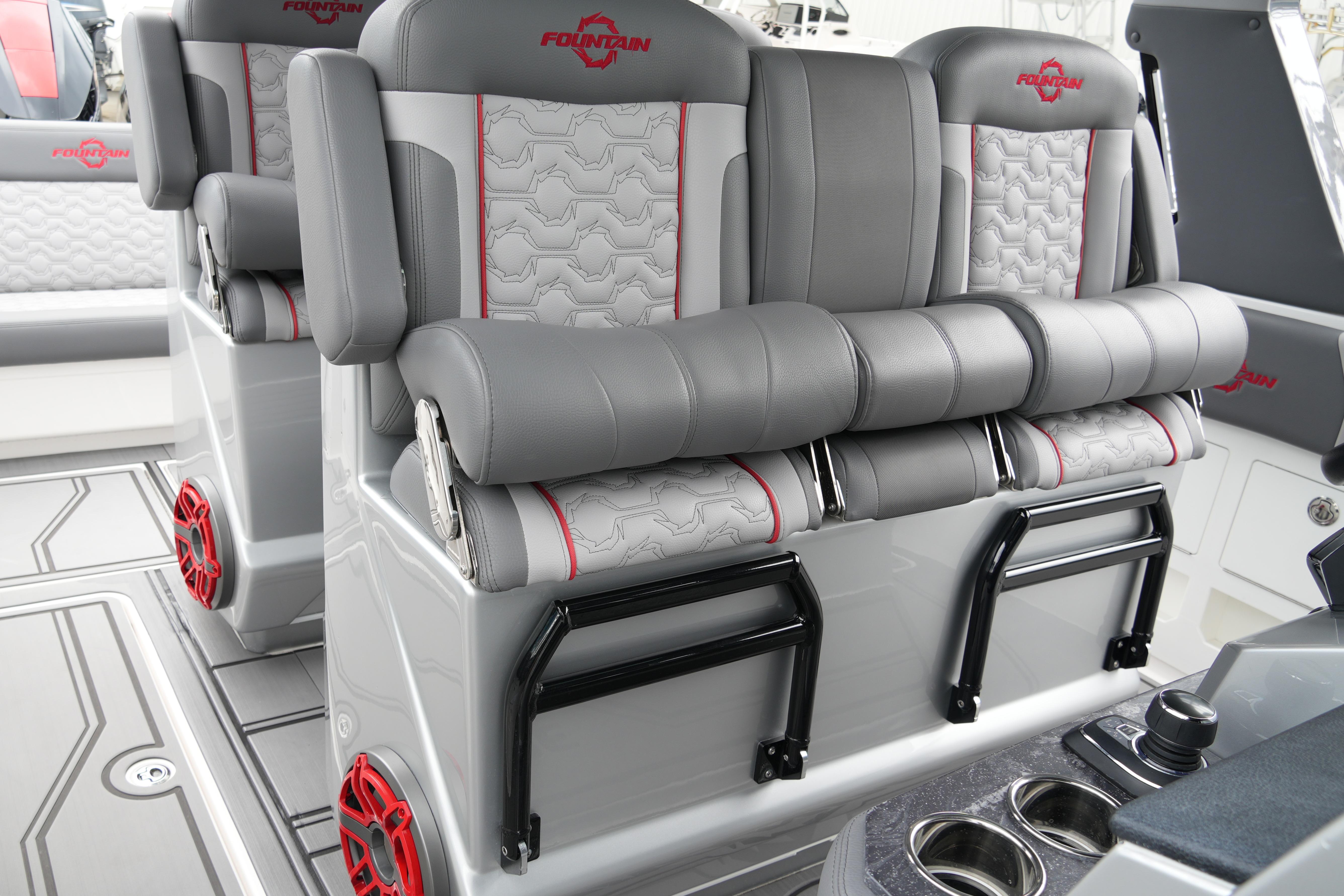 2025 Fountain 38 SCX boat interior with luxurious gray seating and red accents.