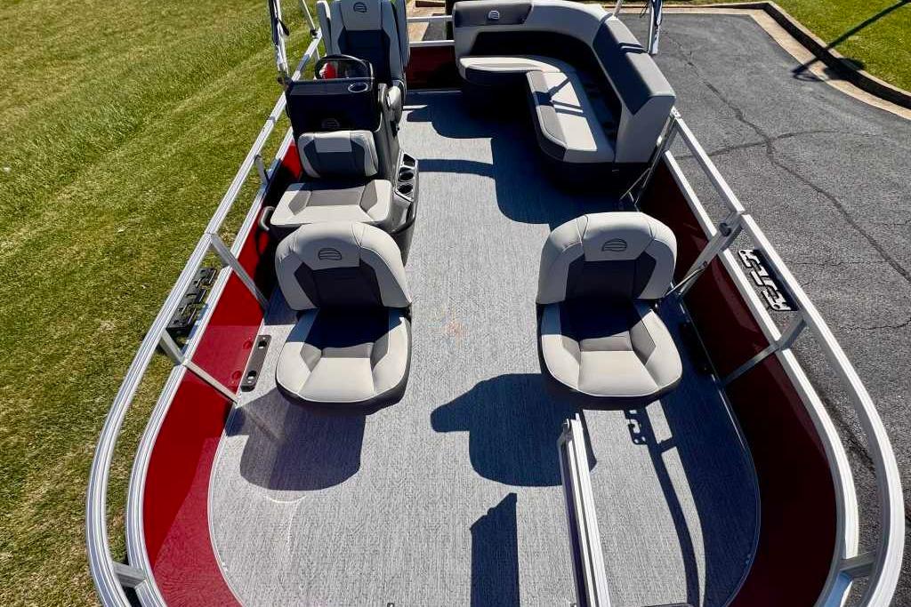 2026 Sun Tracker Bass Buggy 16 XL Select pontoon boat with spacious seating and modern design.