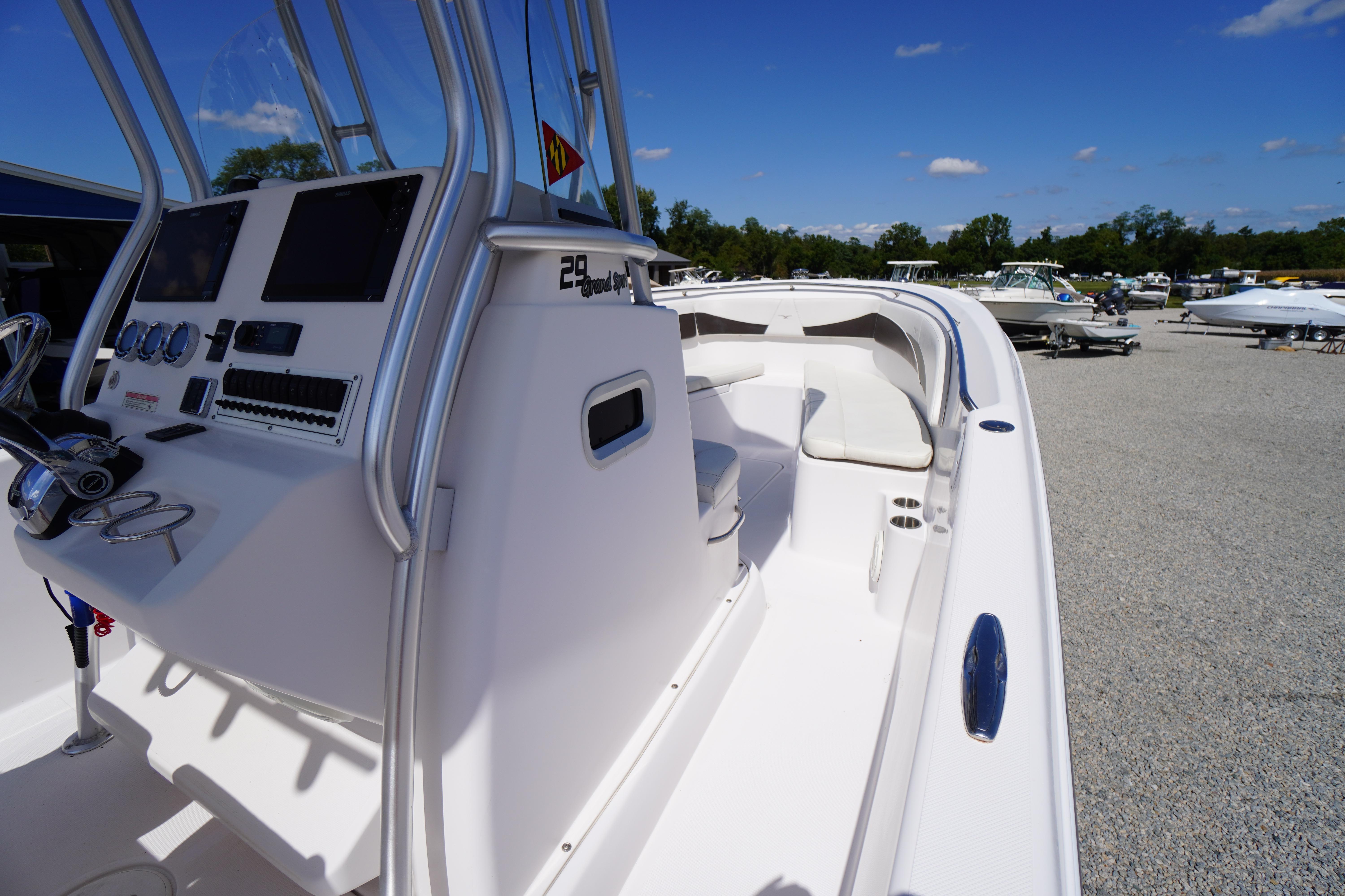 2016 Pro-Line 29 Grand Sport boat with sleek design and modern cockpit controls.