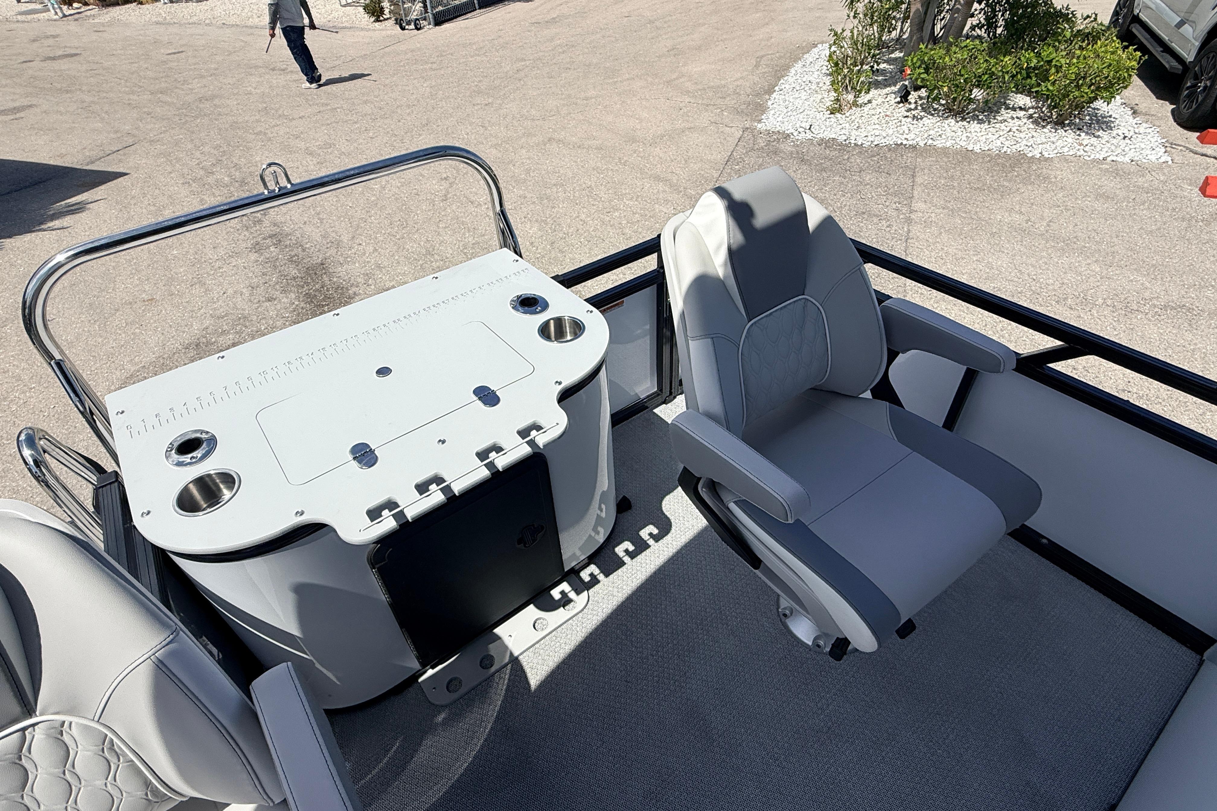 2026 Avalon 2385 Venture 85 Rear Fish boat interior with swivel chair and fishing station.