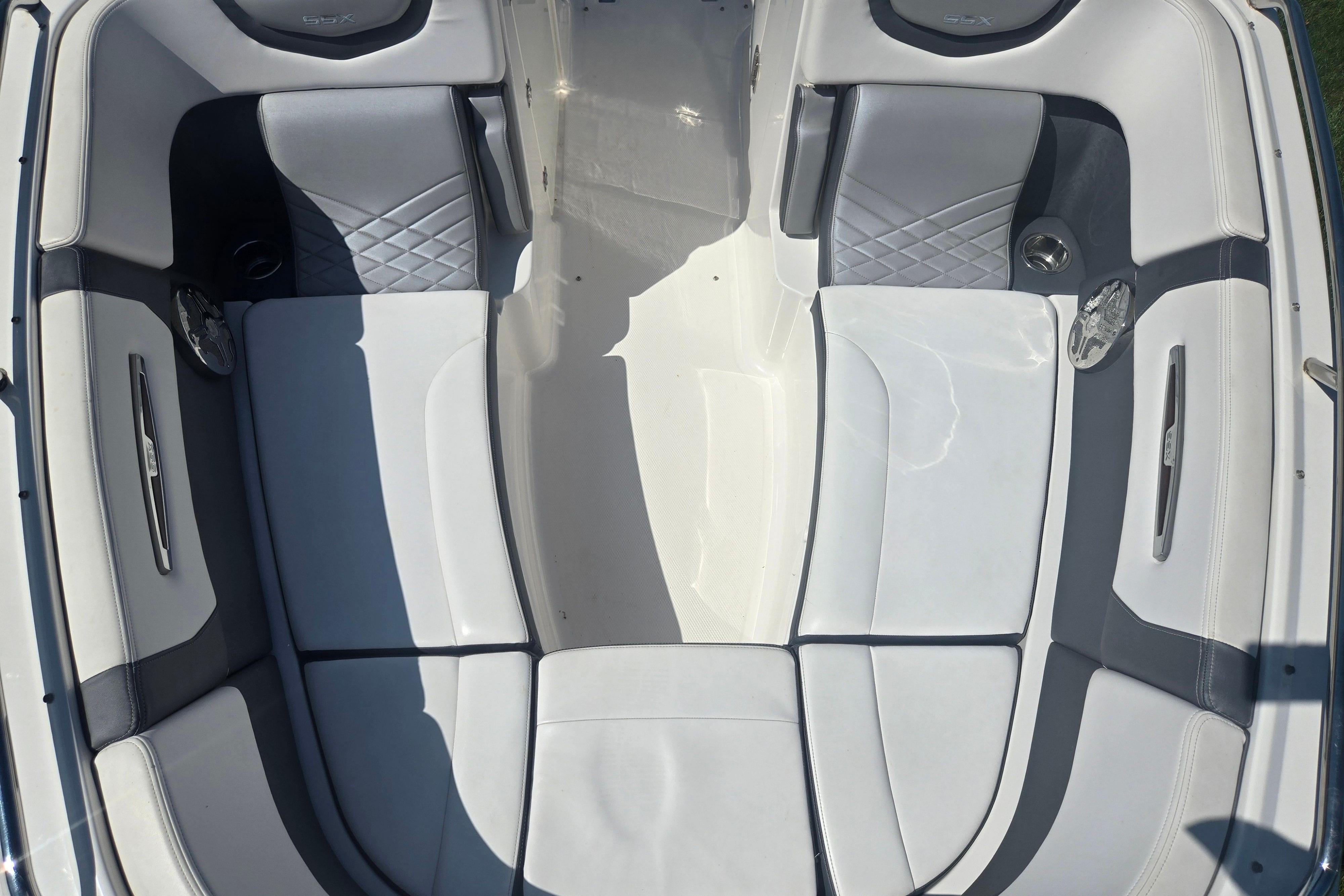 2018 Chaparral 267 SSX boat interior with white and gray seating.