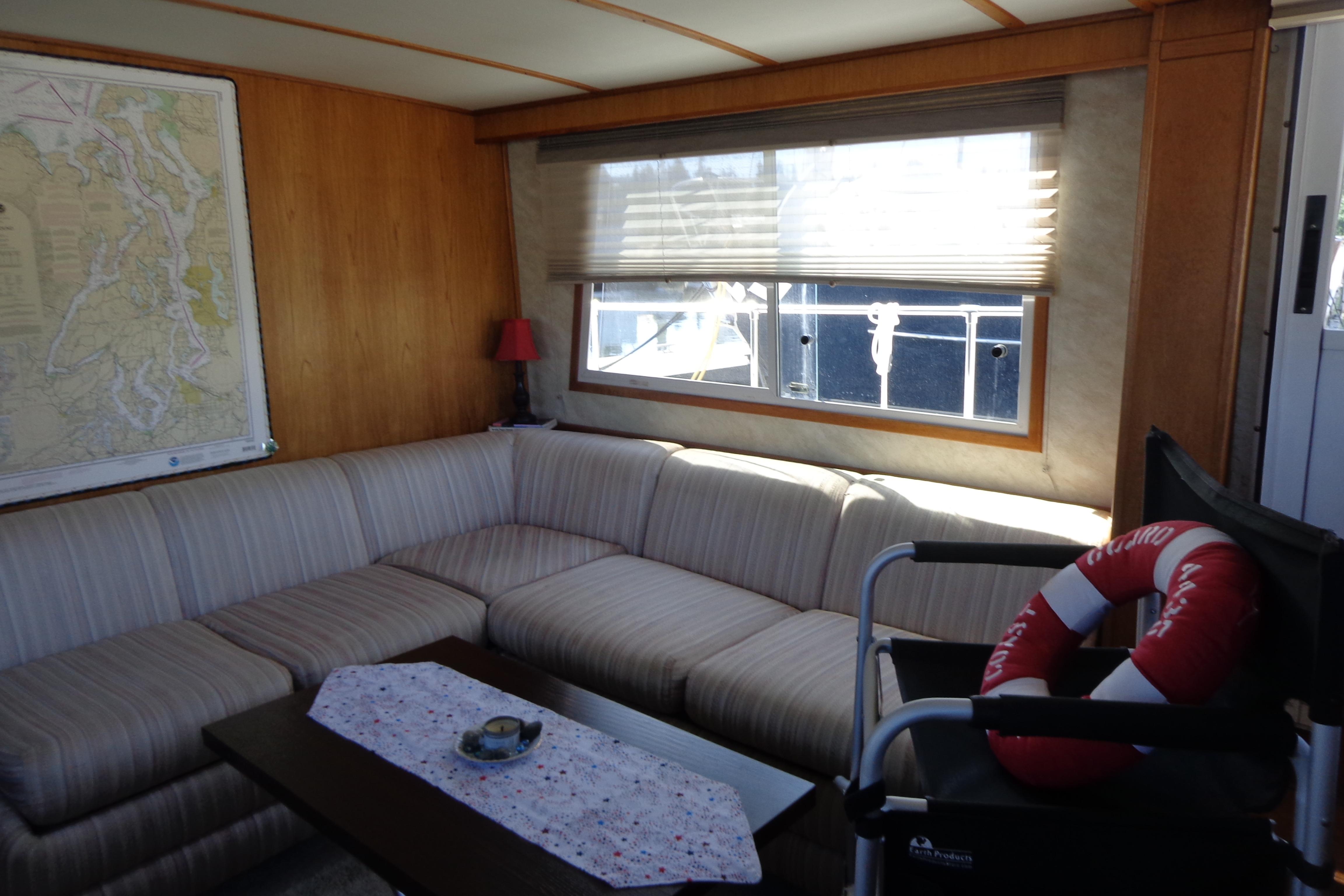Interior of 1992 Cruise-A-Home Corsair 4200 with cozy seating and nautical decor.