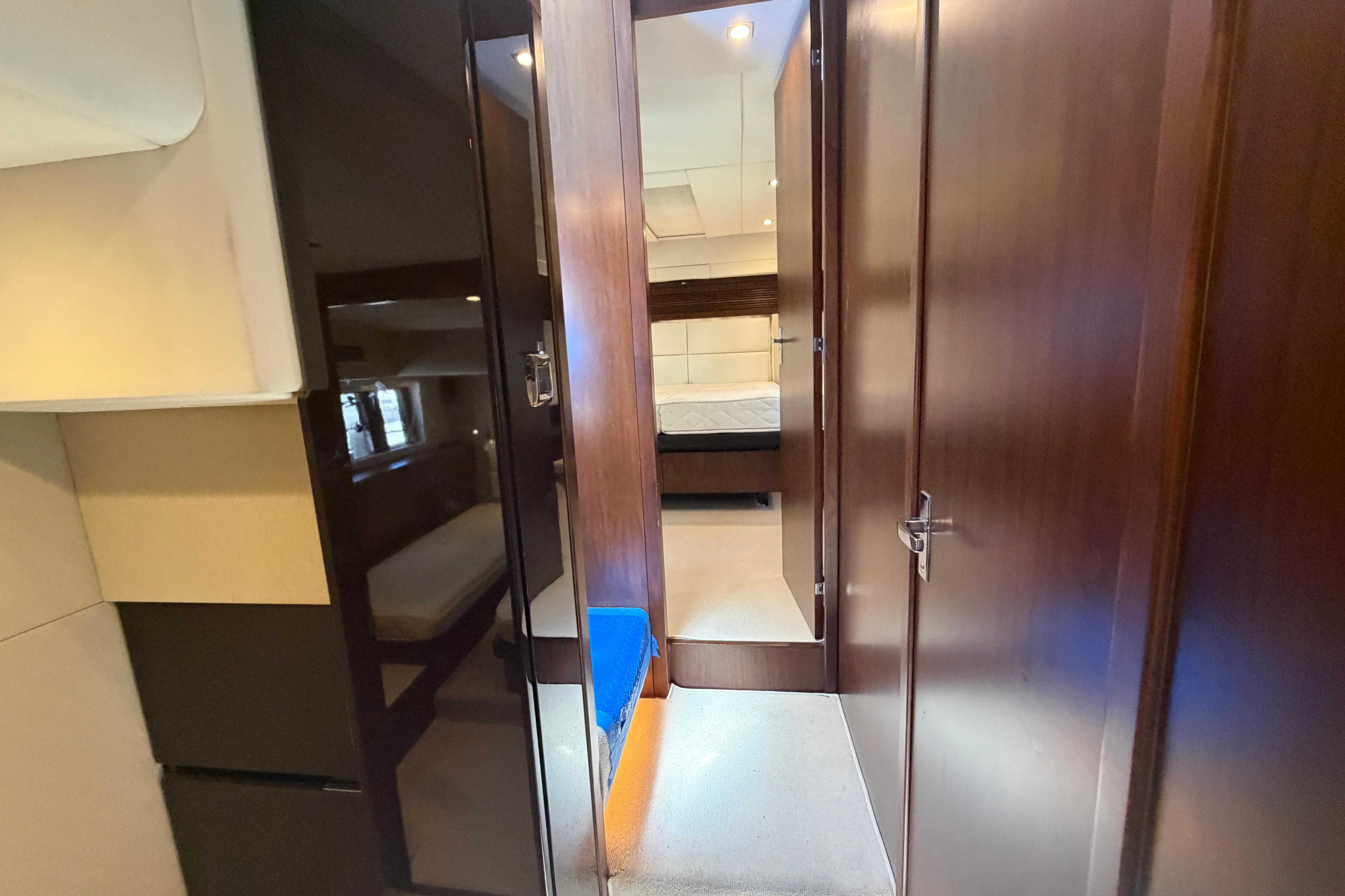 Interior view of 2015 Fairline Squadron 50 yacht cabin with wooden finishes.