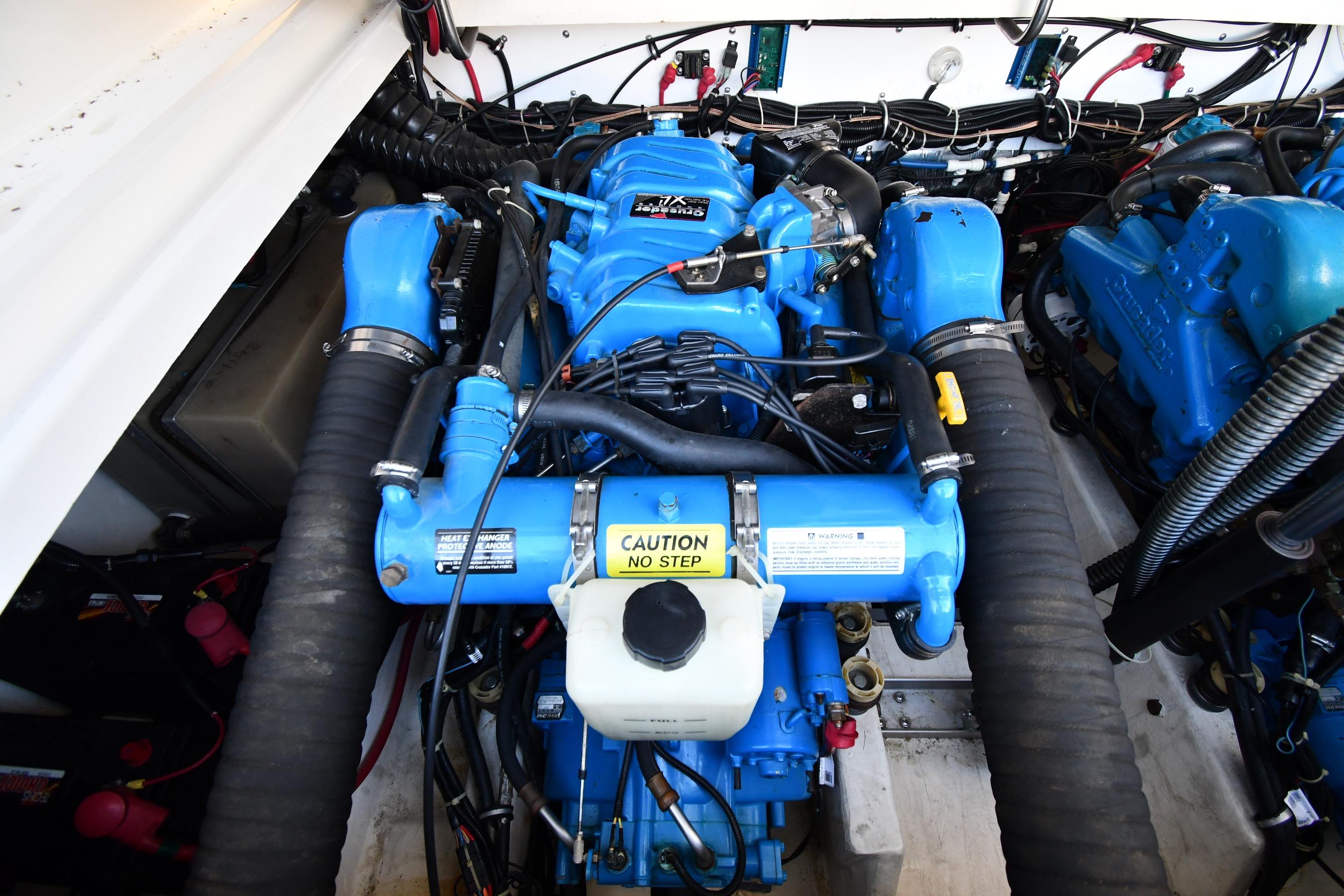 Engine compartment of a 1998 Tiara Yachts 3100 Open, featuring blue marine engines.