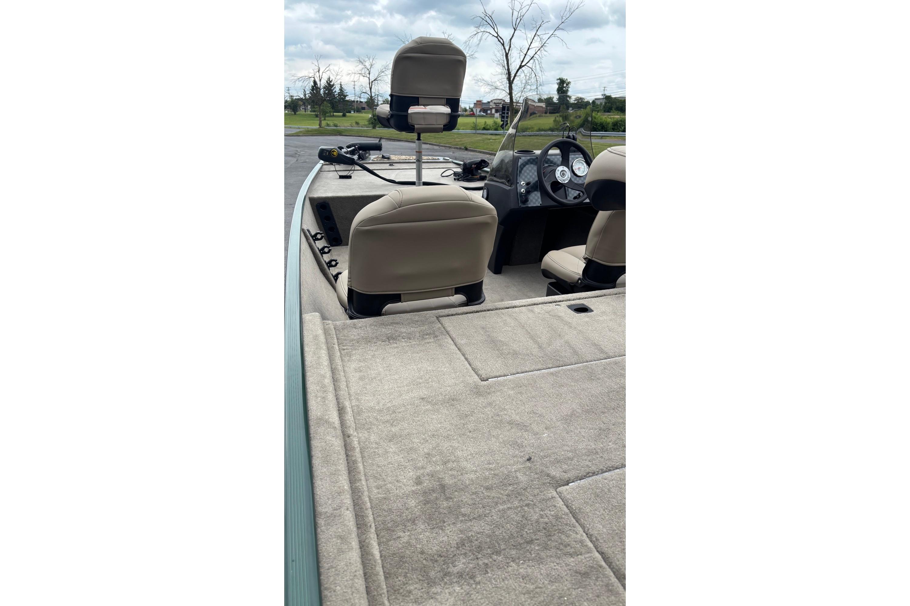 2026 Tracker Bass Tracker Classic Limited boat interior with beige seats and dashboard.