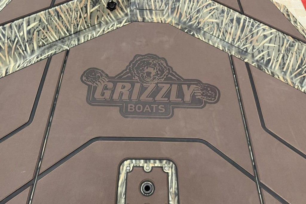 2026 Tracker Grizzly 1754 SC boat deck with logo and camouflage design.