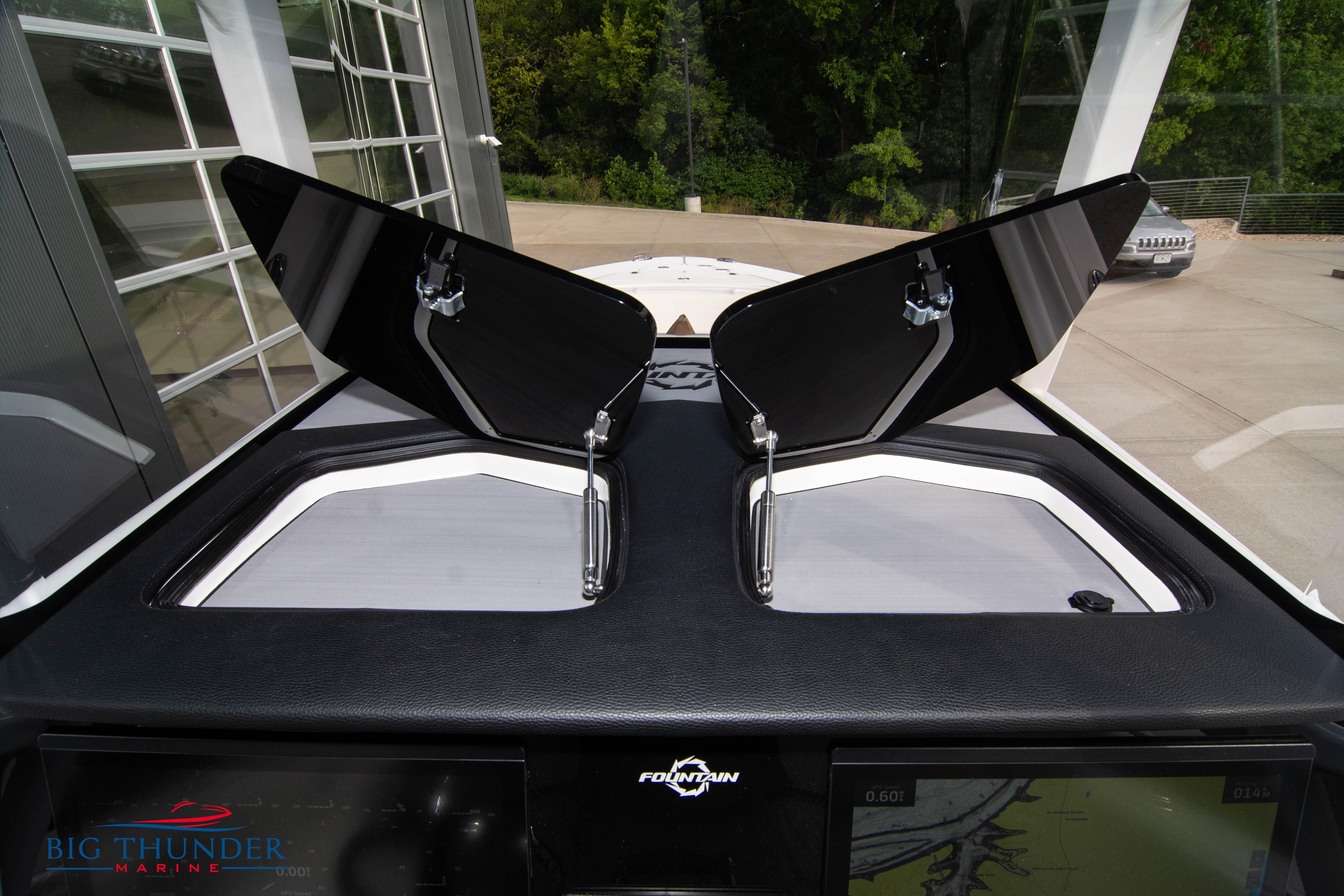 2023 Fountain 34 Center Console boat dashboard with open hatches, showcasing modern design.