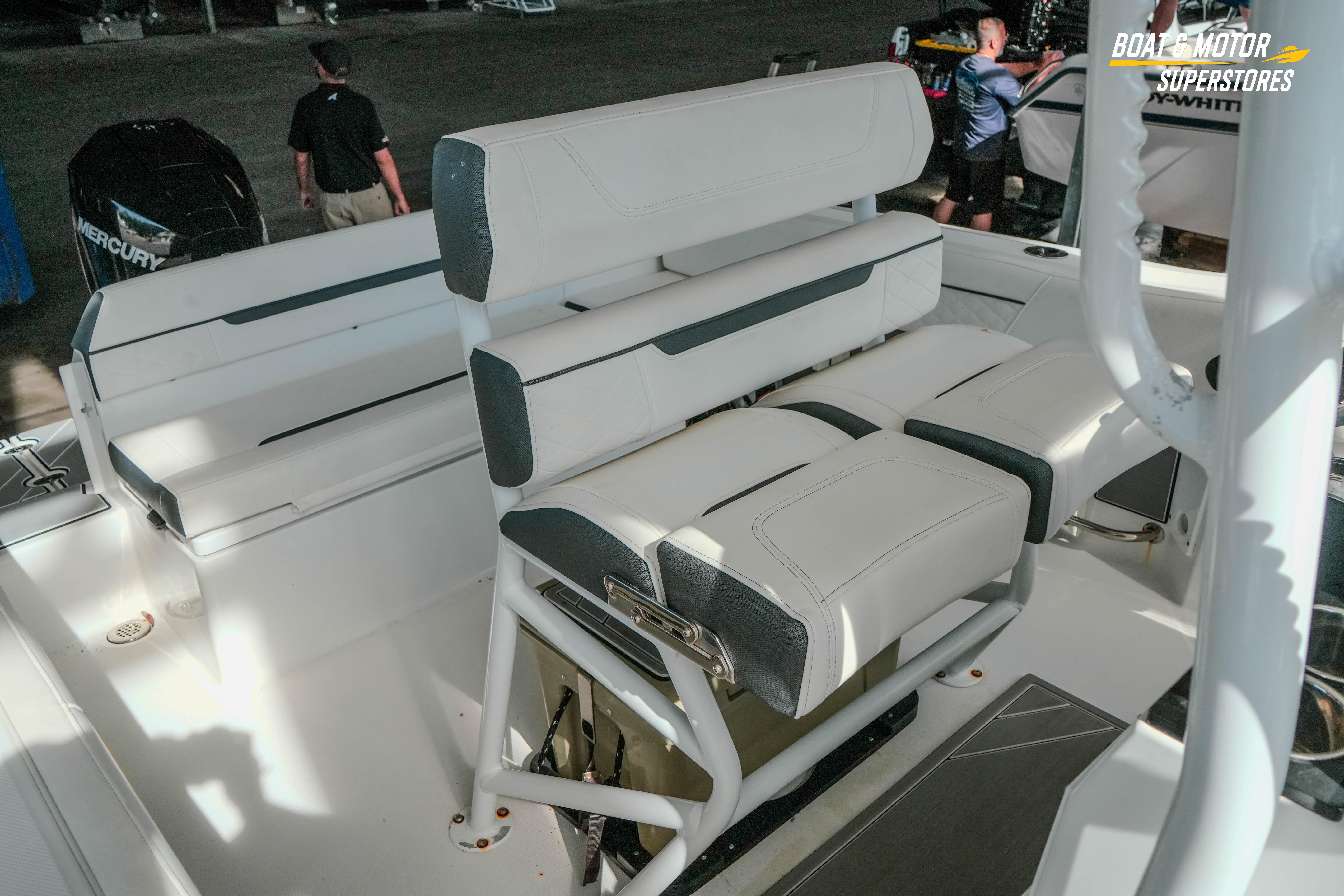 2022 Blackfin 222 CC boat interior with white seating and Mercury engine.