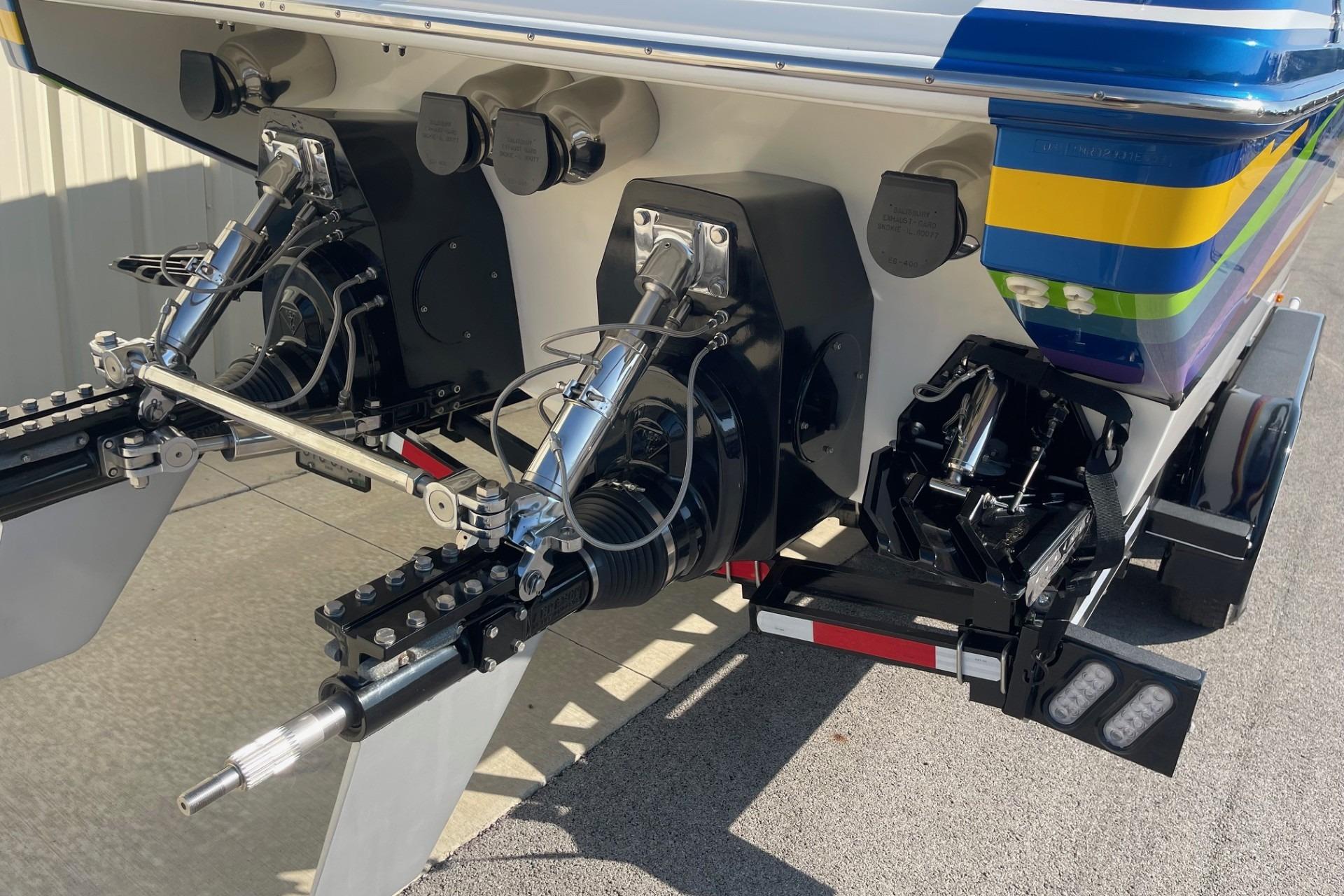 Rear view of a 2004 Formula 382 FASTech boat with dual outboard motors.