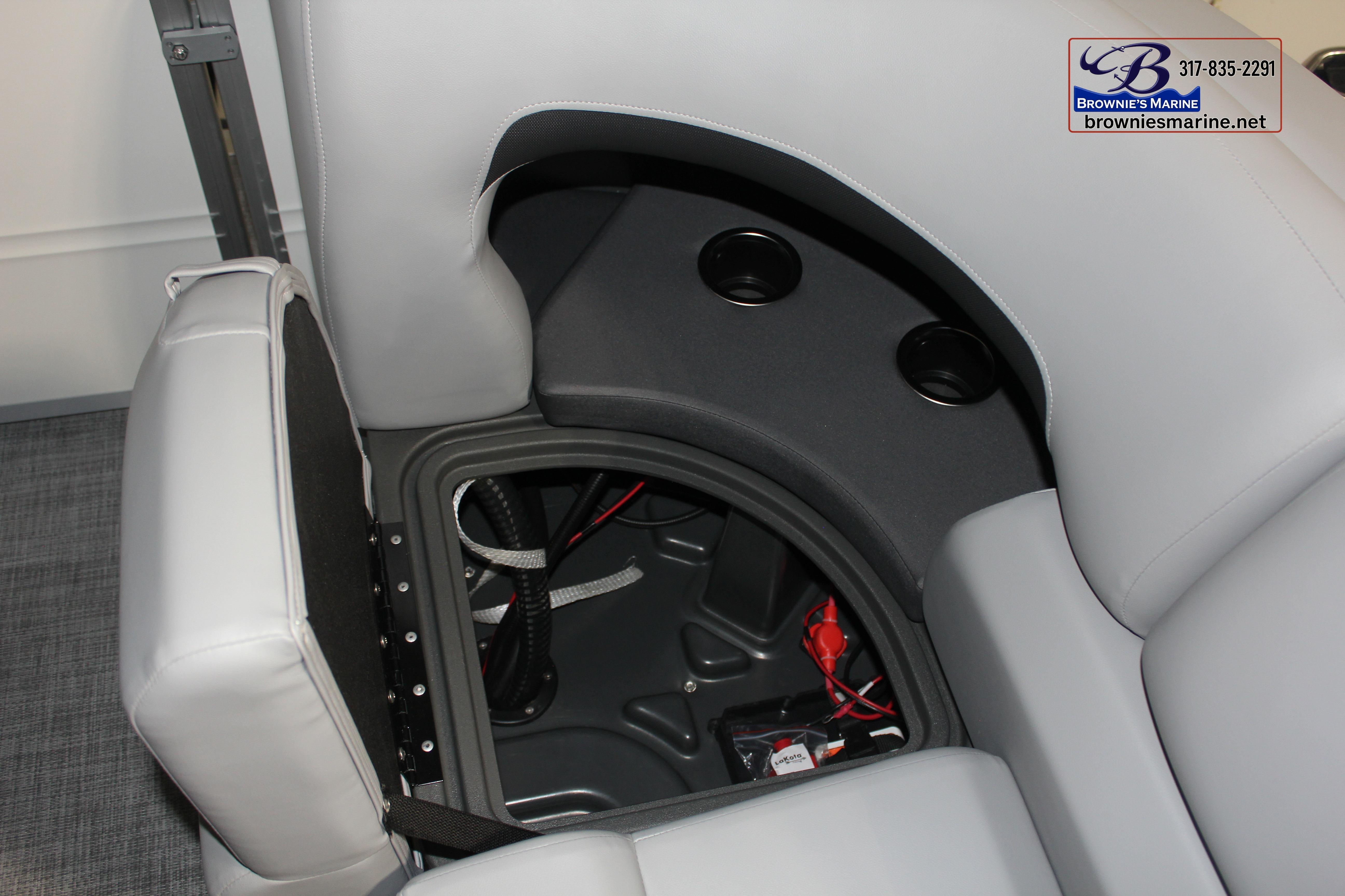 2026 Sun Tracker Party Barge 22 DLX interior storage compartment with cup holders.