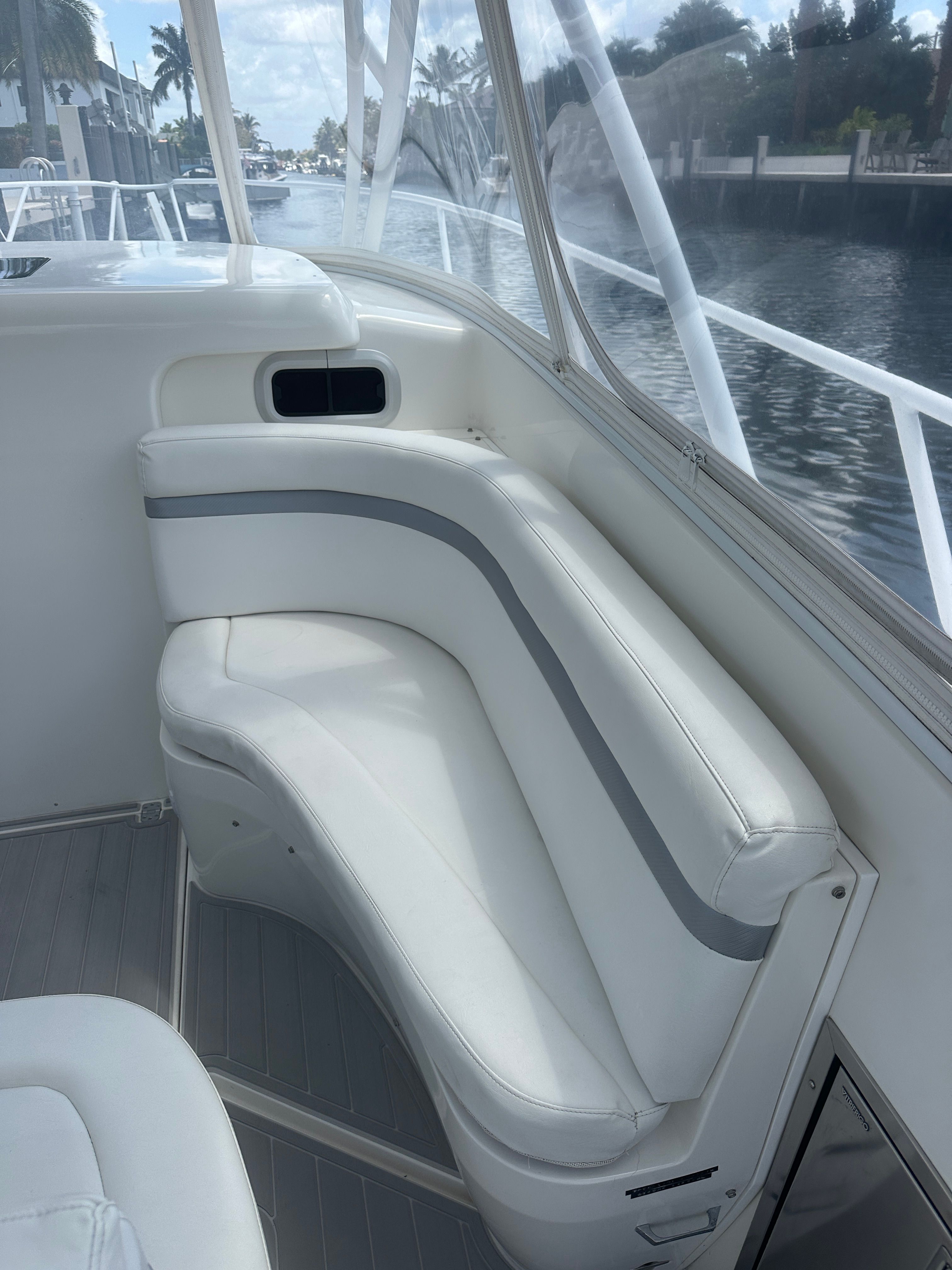 Interior of a 2004 Intrepid 377 Walkaround with white seating area.