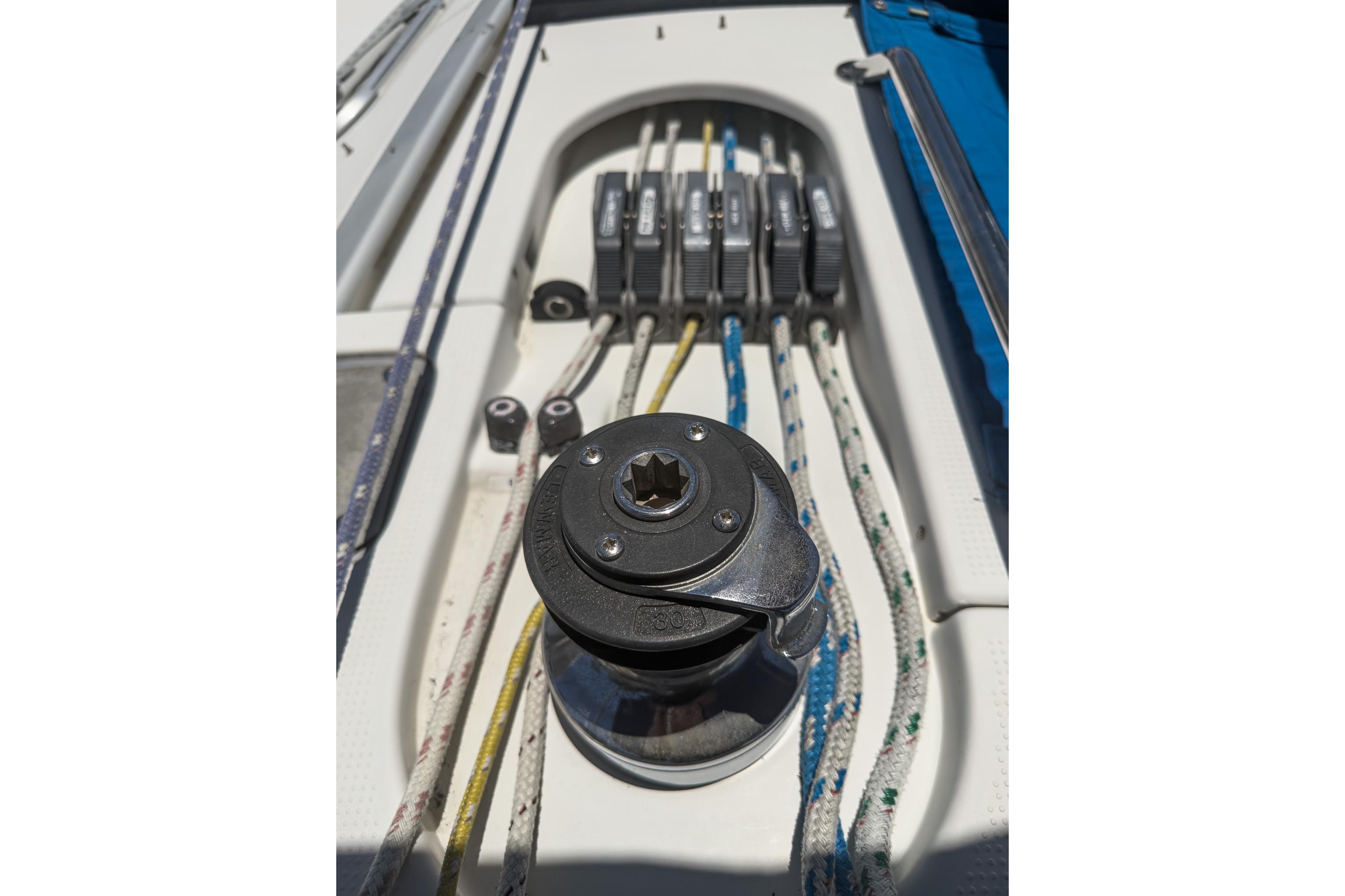 Winch and ropes on 1993 Beneteau First 38 s5 sailboat deck.