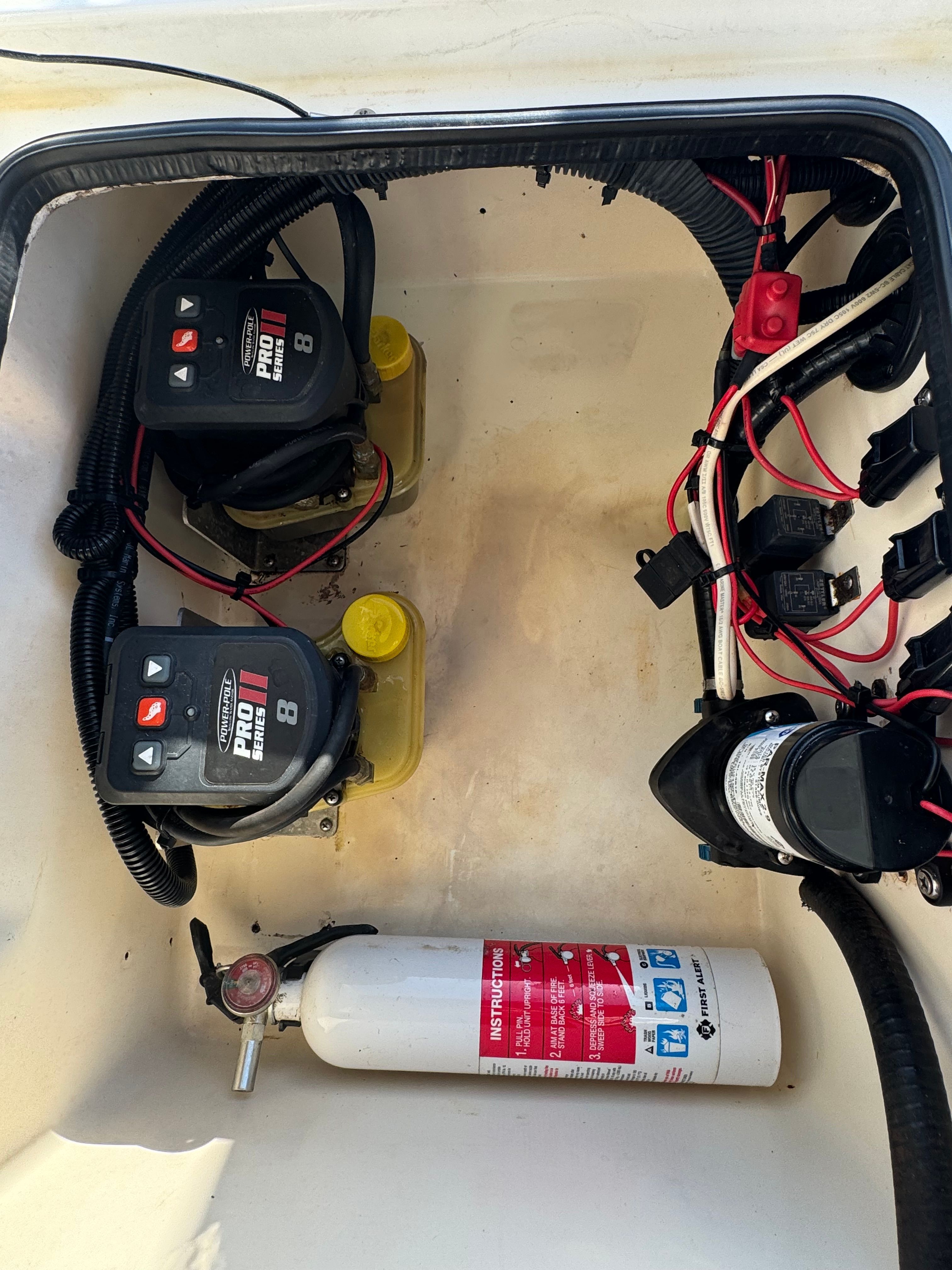 Electrical compartment of a 2004 ShearWater LTZ with fire extinguisher.