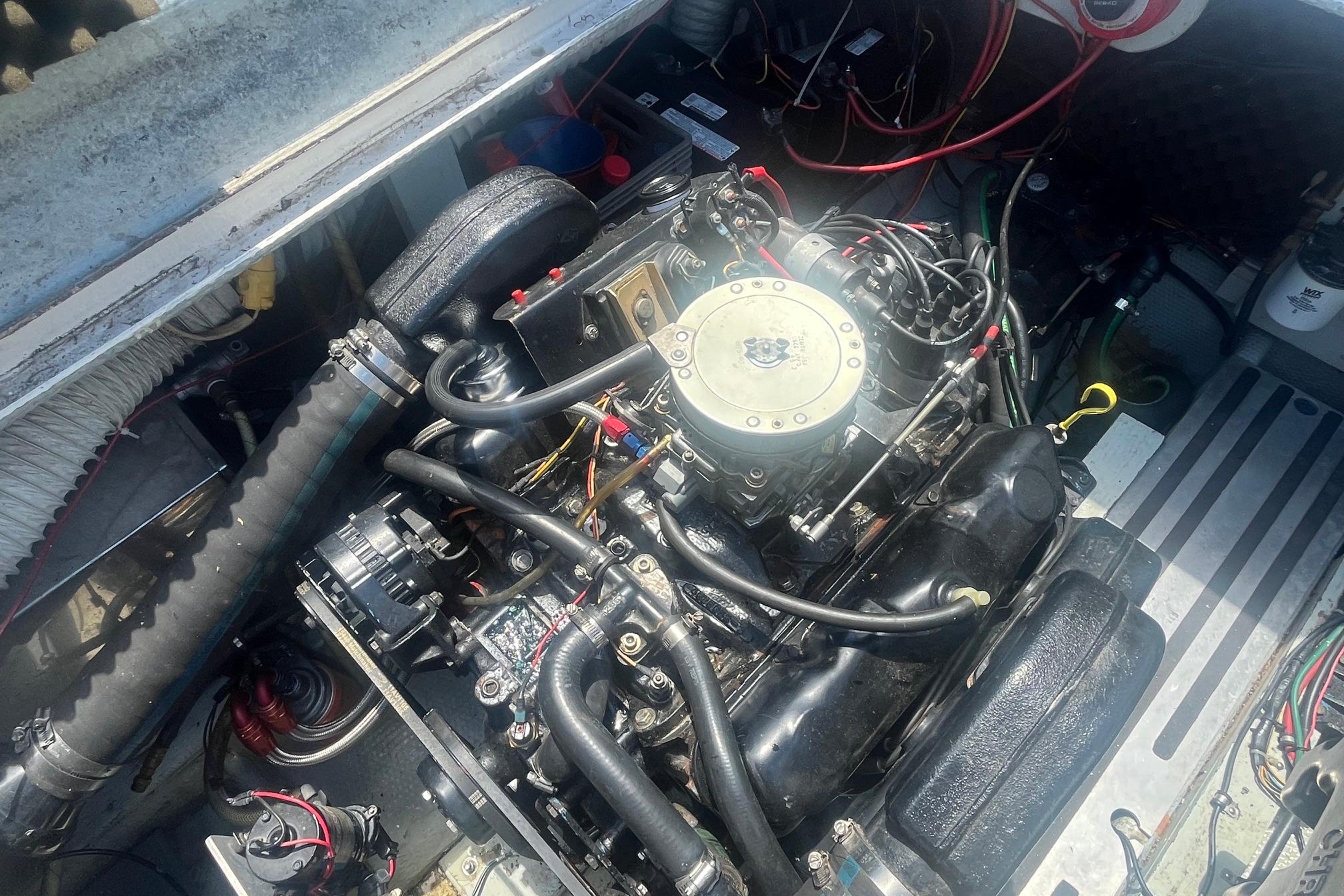 Engine compartment of a 1988 Seafox 29 Flybridge boat, showcasing detailed mechanical components.
