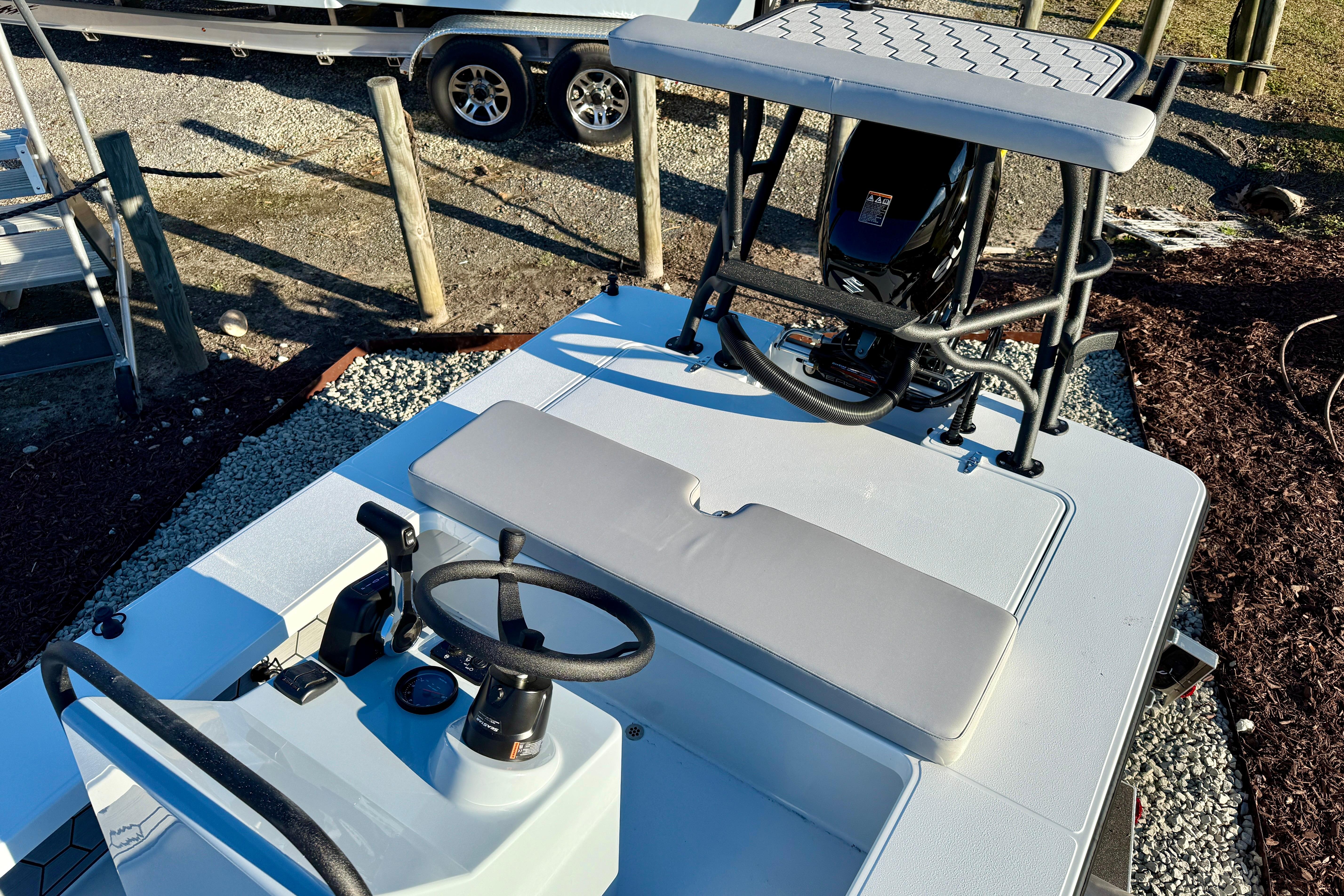 2026 East Cape EVO 17V boat interior with steering wheel and seating.