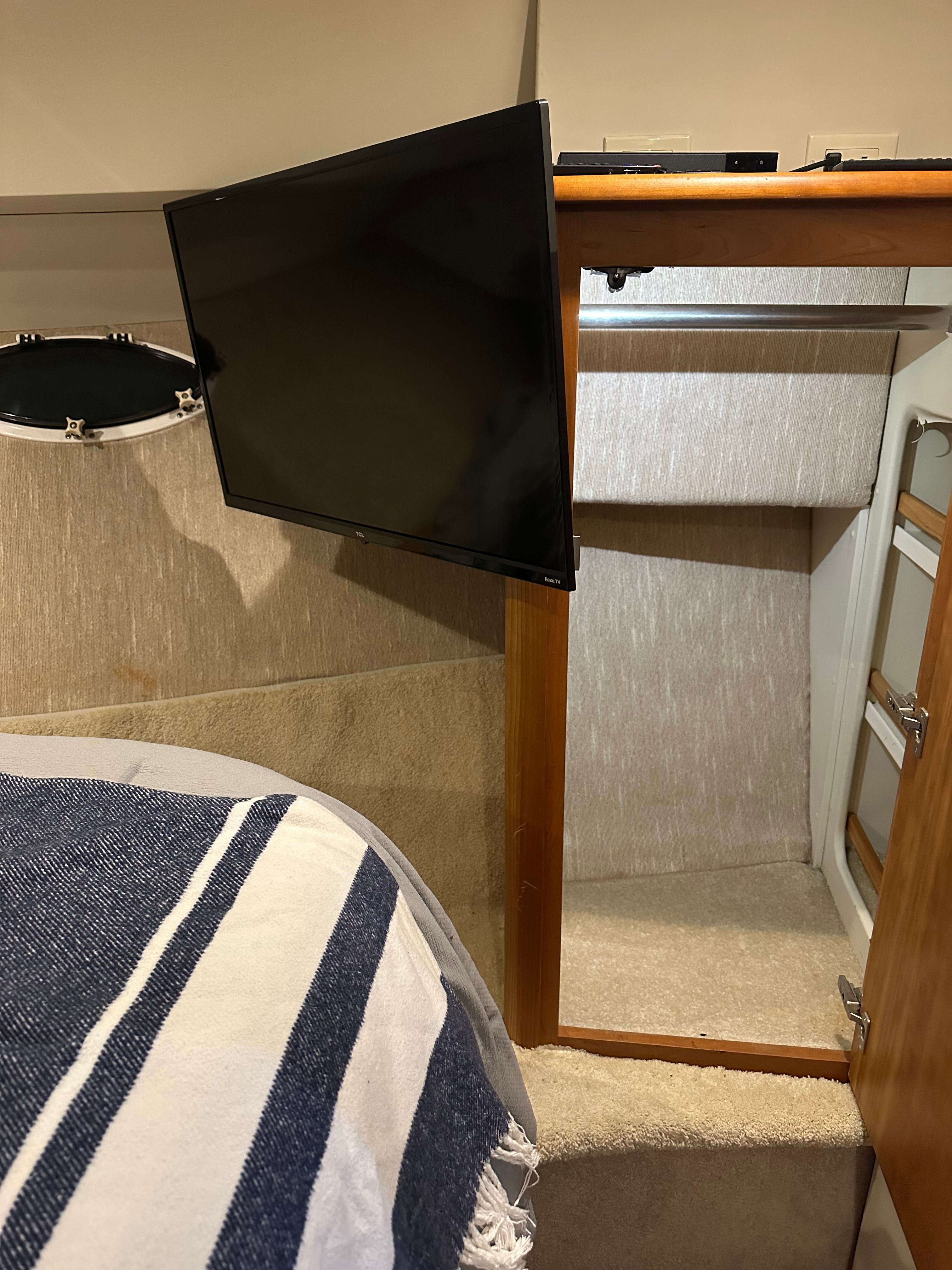 Interior of 2000 Silverton 351 Sedan with TV and storage space.