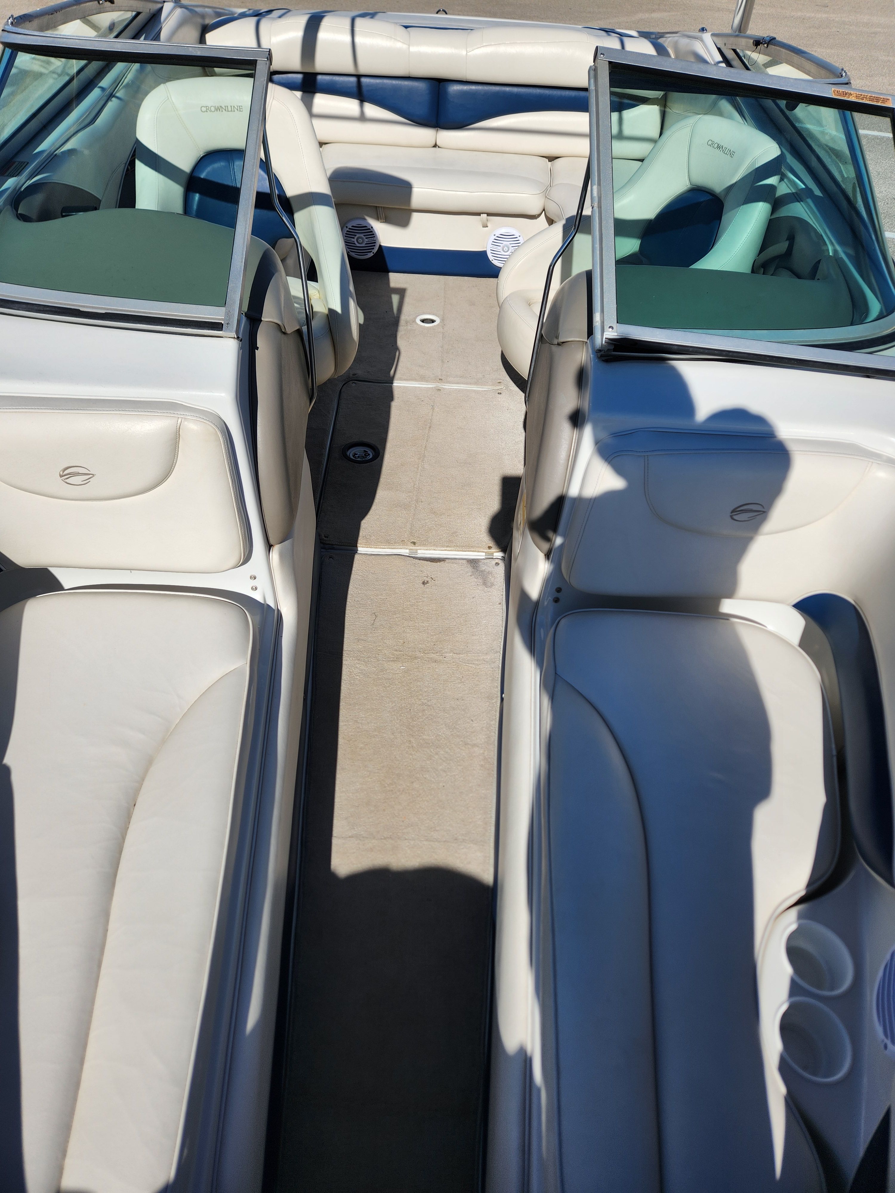 Interior of a 2003 Crownline 225 BR boat with beige seating.