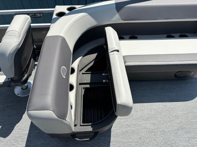 2026 Sun Tracker Bass Buggy 18 DLX boat interior with gray seating and storage compartment.