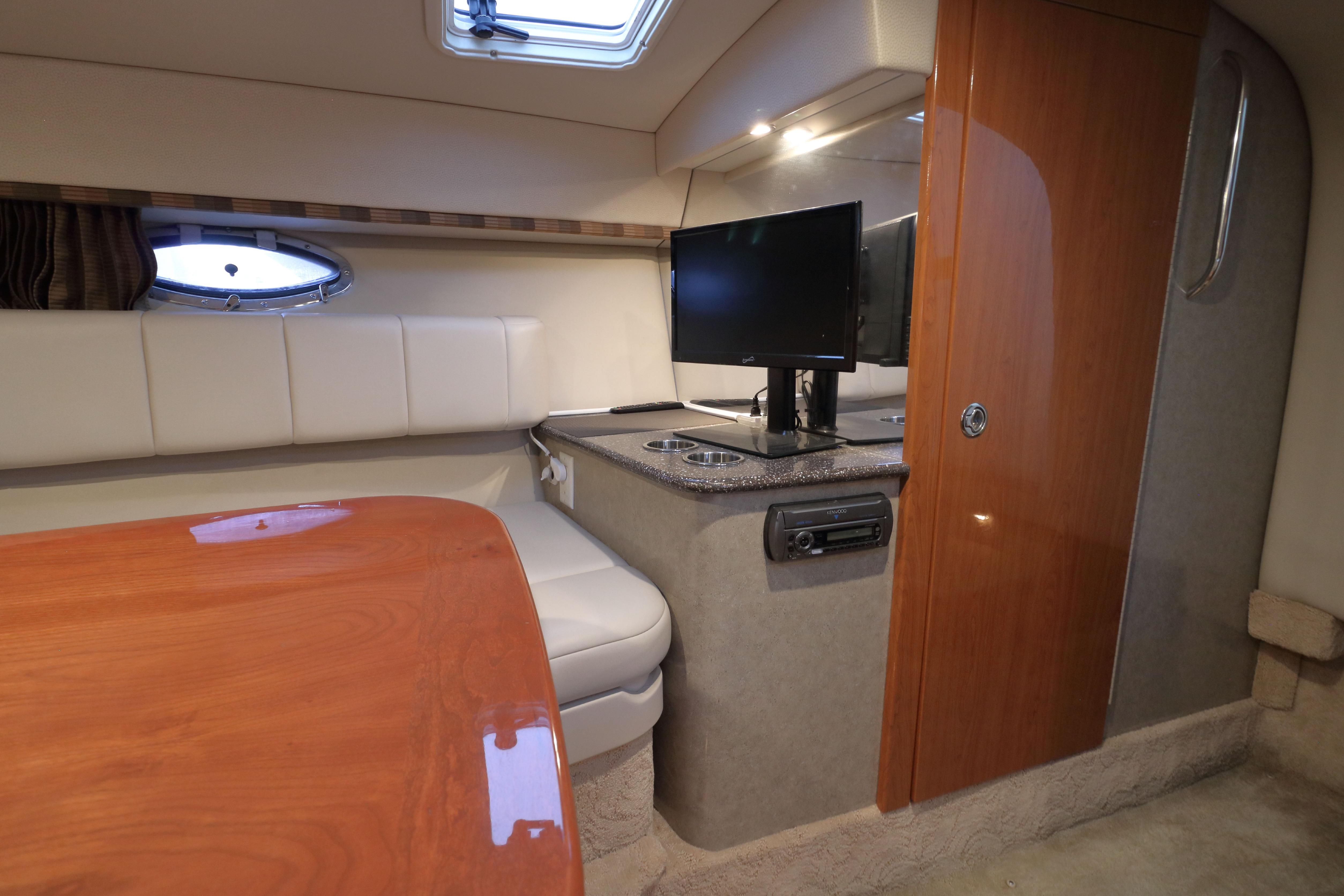 Interior of 2006 Formula 330 Sun Sport boat with TV and seating area.
