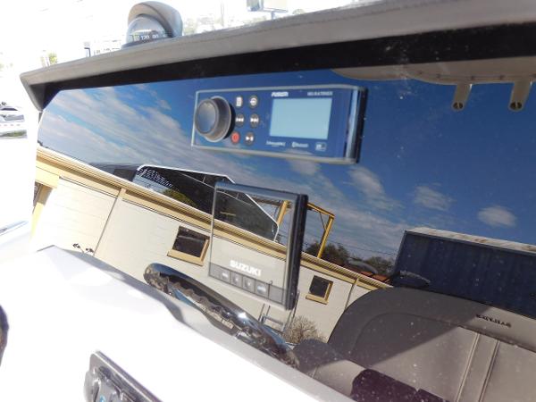 2024 Sailfish 242 CC boat dashboard with Suzuki control panel.