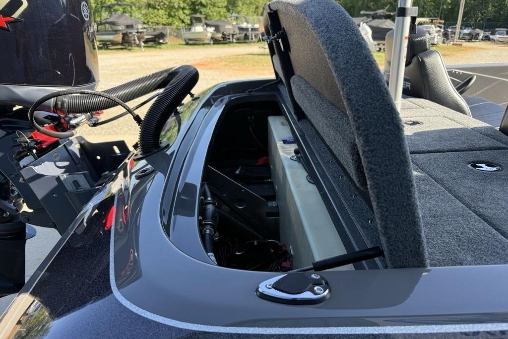 Open storage compartment on a 2026 Skeeter ZX150 boat, showcasing interior details.
