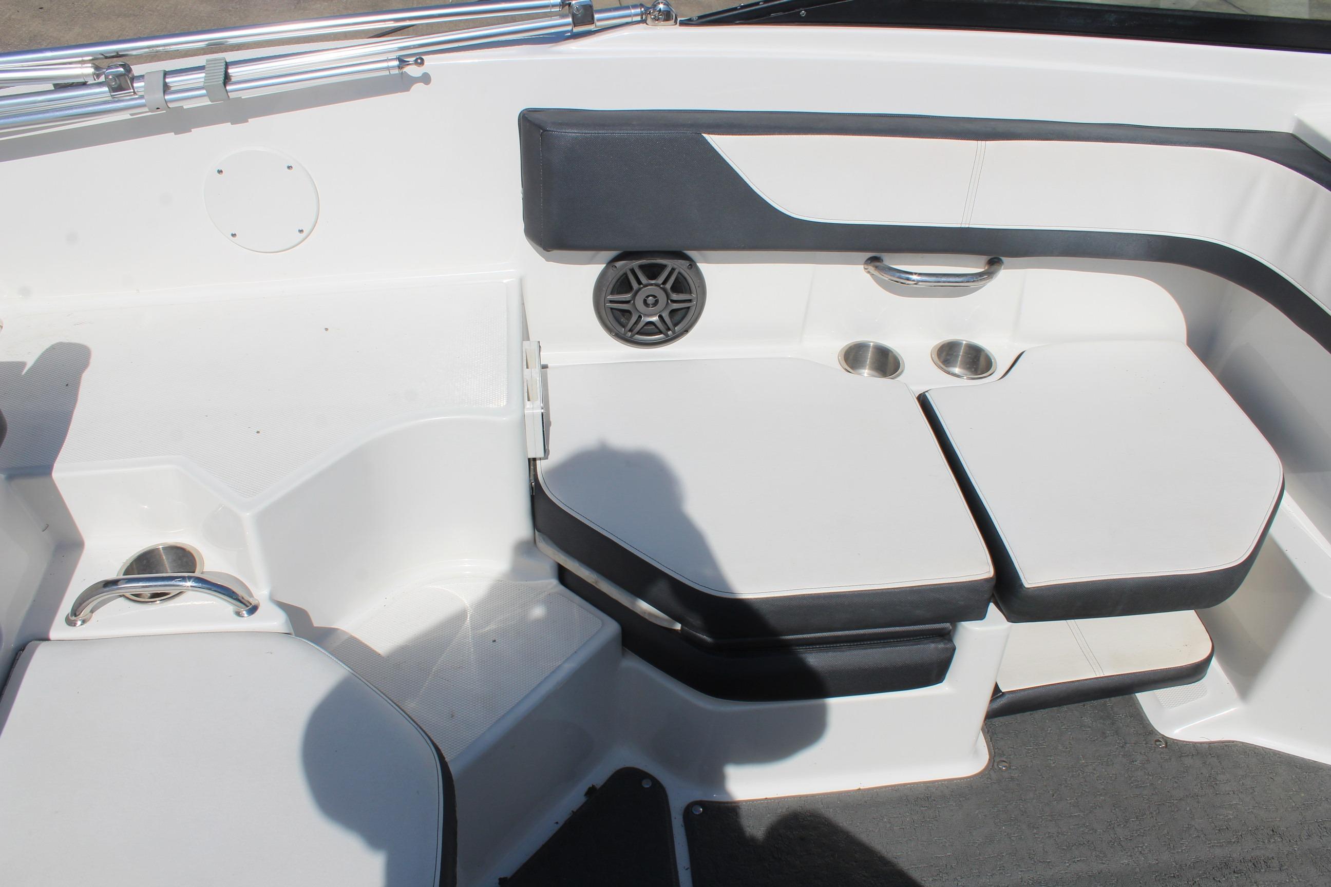 2015 Sea Ray 19 SPX OB boat interior with cushioned seating and cup holders.