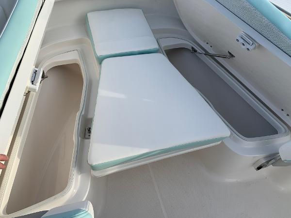 2024 Robalo R202 Explorer boat interior with storage compartments and cushioned seating.
