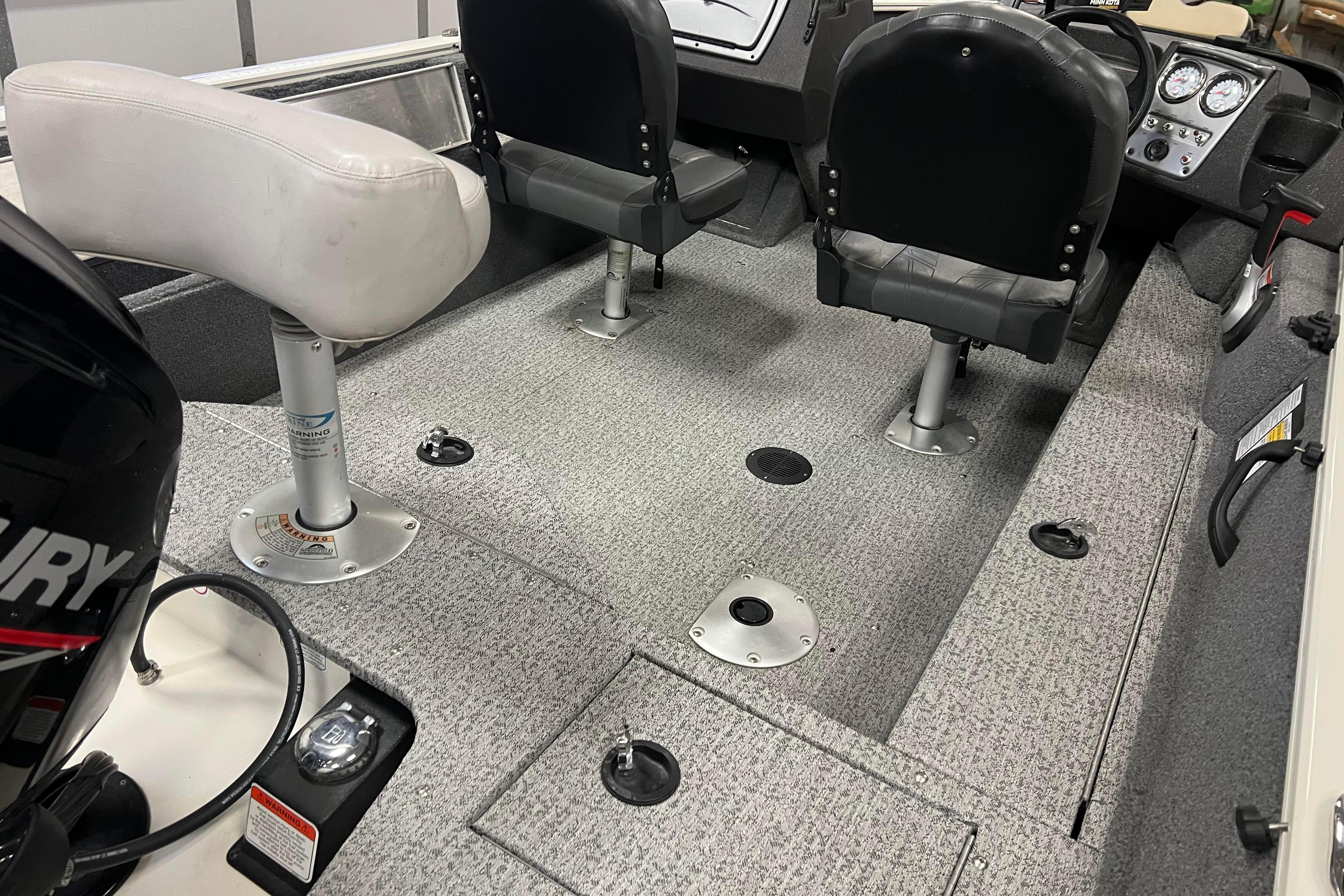 2022 Tracker Pro Guide V-16 WT boat interior with seating and control panel.