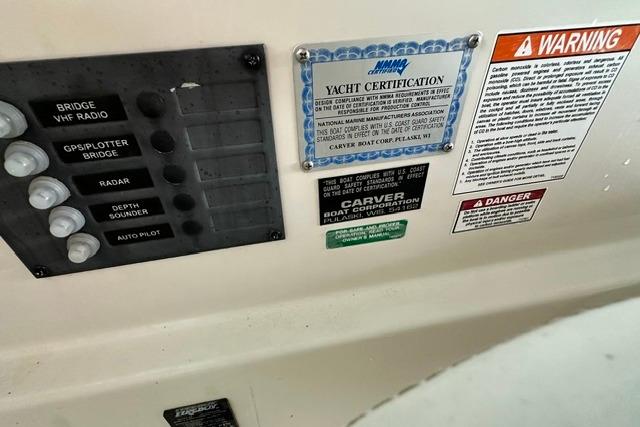 Control panel and certification labels on a 2004 Carver 360 Mariner yacht.