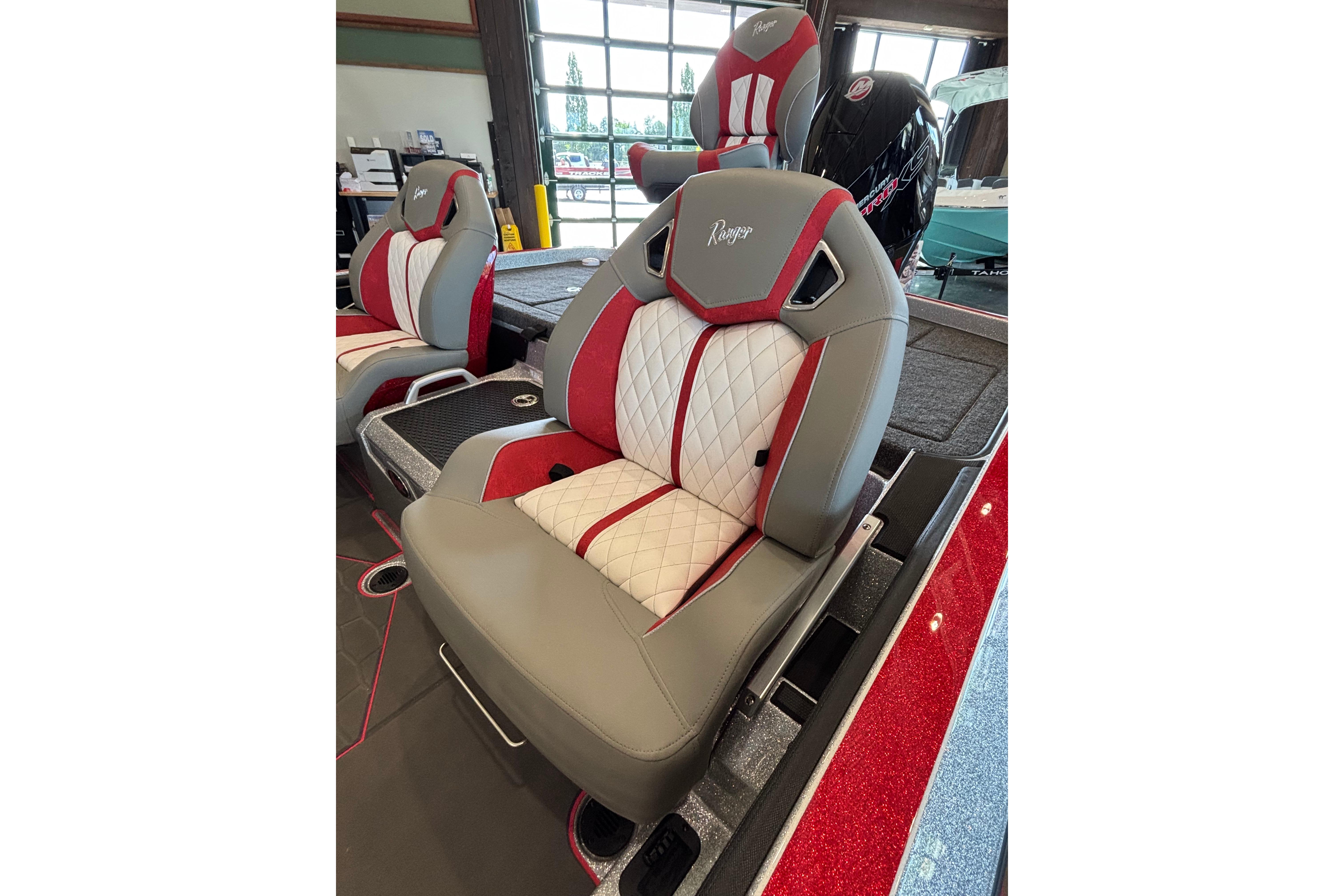 Luxurious seating in 2026 Ranger Z520R Cup-Equipped boat, featuring red and white accents.