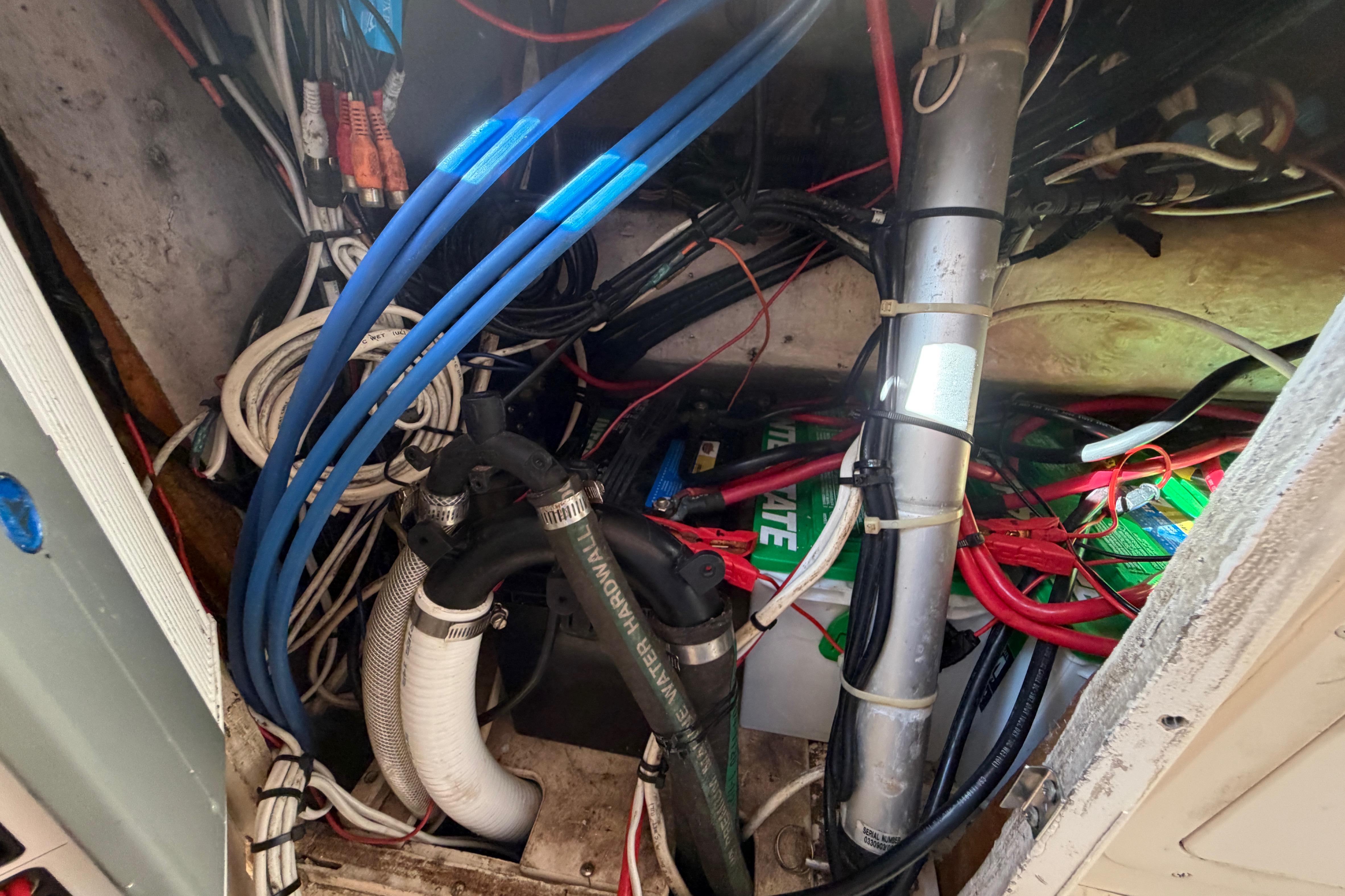 Electrical wiring and components inside a 2004 Grady White 273 boat.