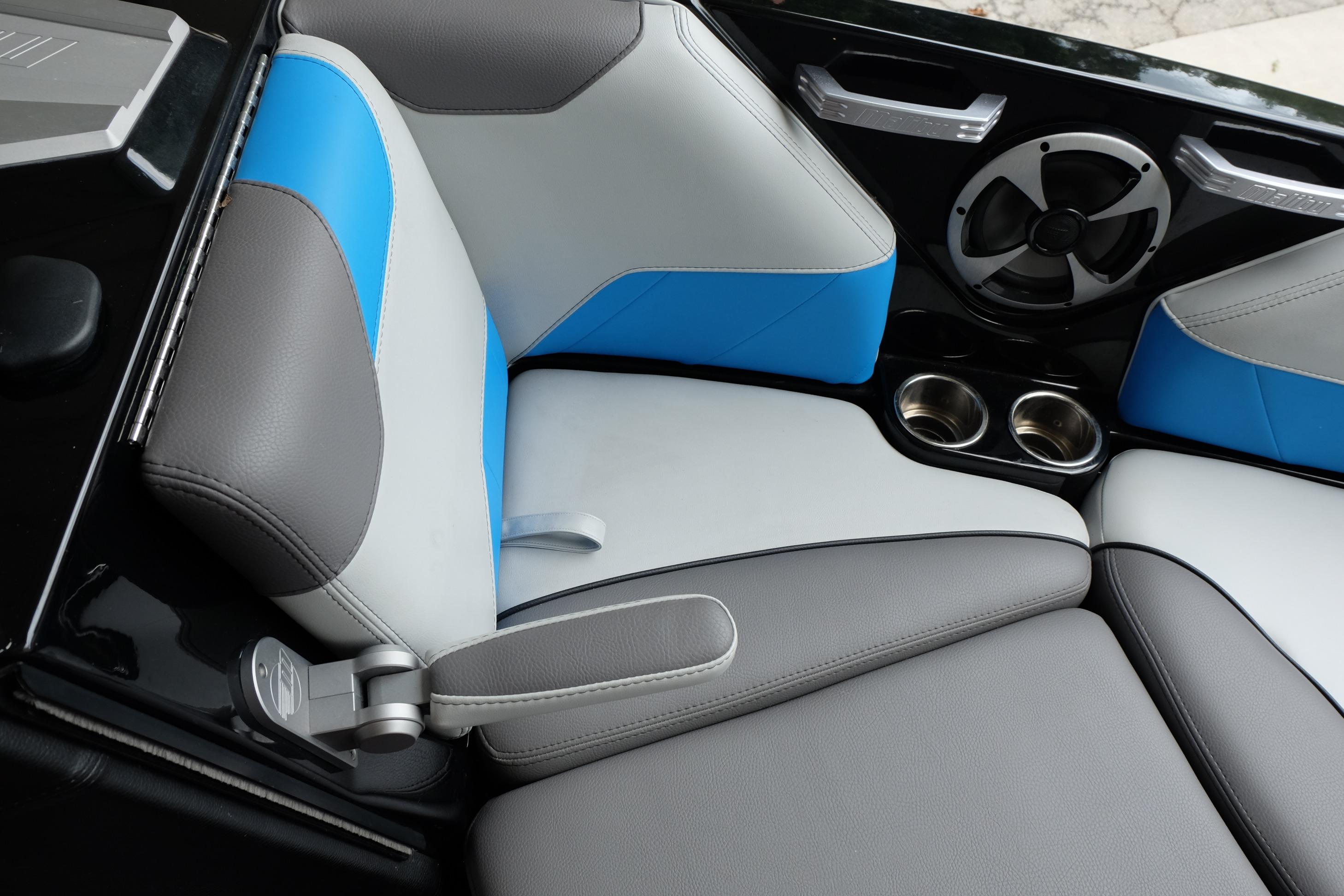2020 Malibu Wakesetter 23 LSV interior seating with blue accents and cup holders.