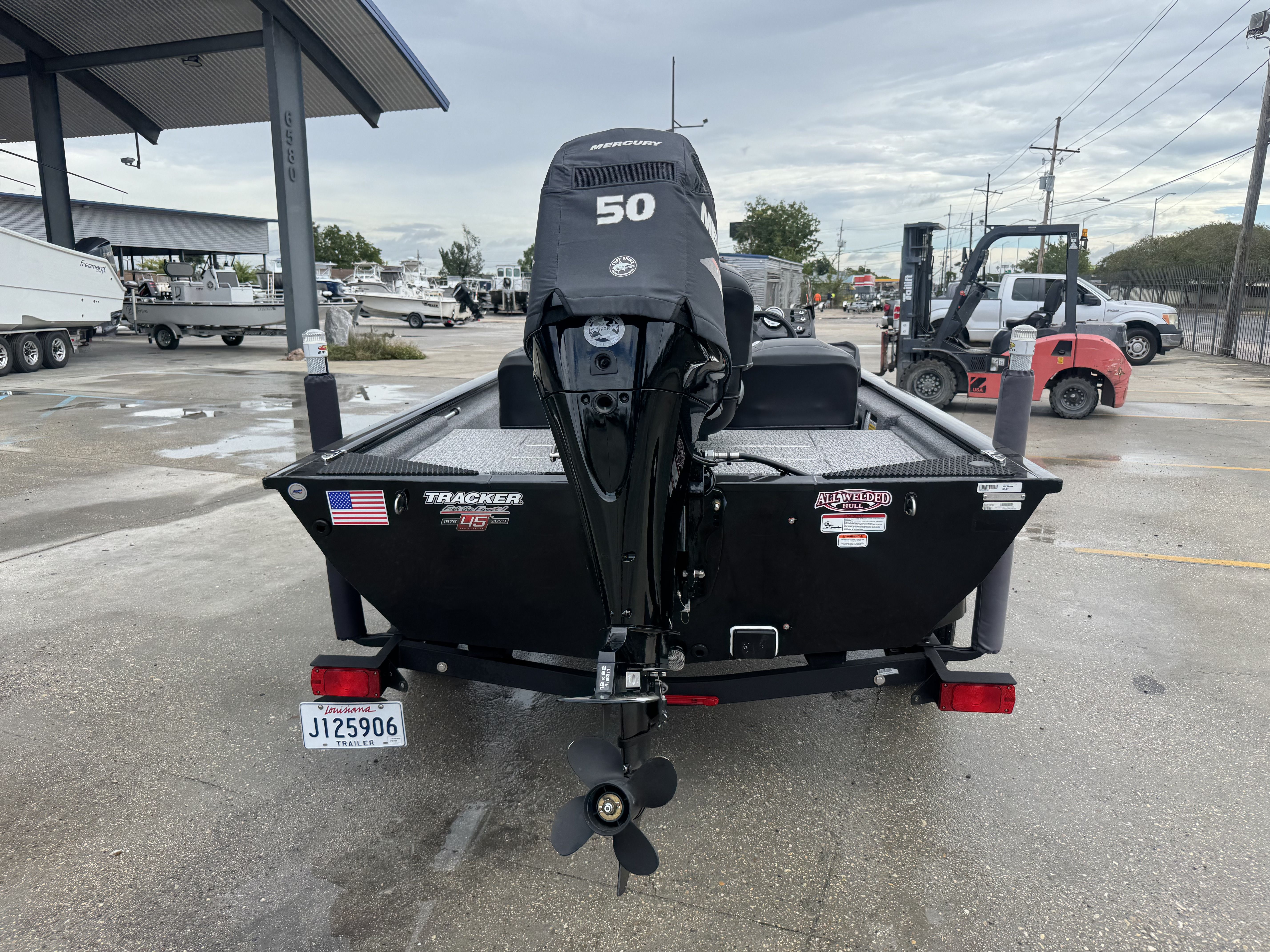 2024 Tracker Pro 170 boat with Mercury 50 engine at a dealership.