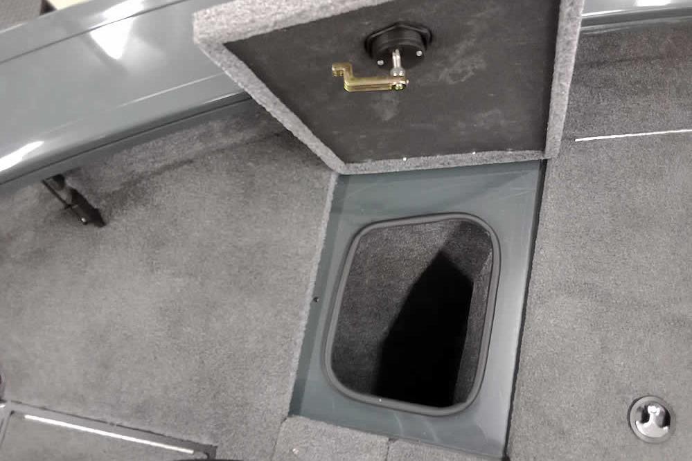 Interior storage compartment of 2026 Ranger VX1888 WT boat, featuring carpeted flooring.