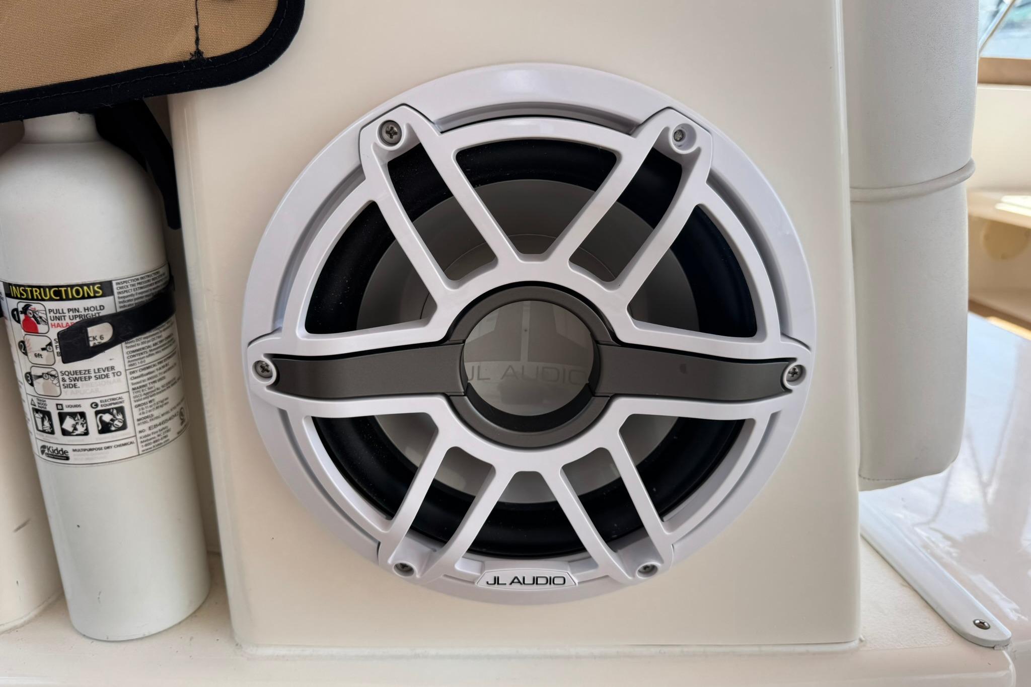 JL Audio speaker on 2001 Sea Ray 340 Sundancer boat, next to a fire extinguisher.