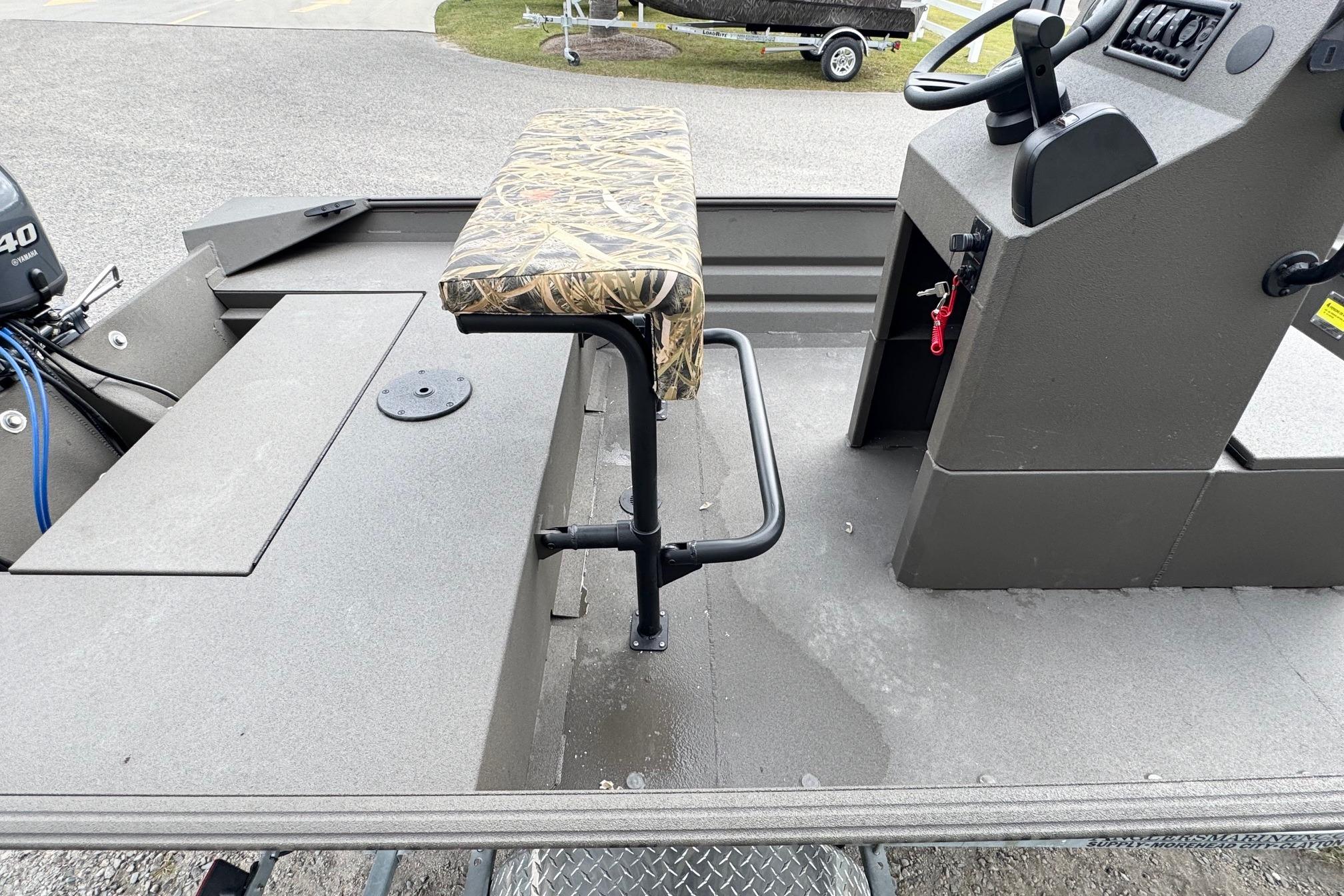 2026 Alweld 1656VV Marsh Console CC boat interior with camo seat and control console.
