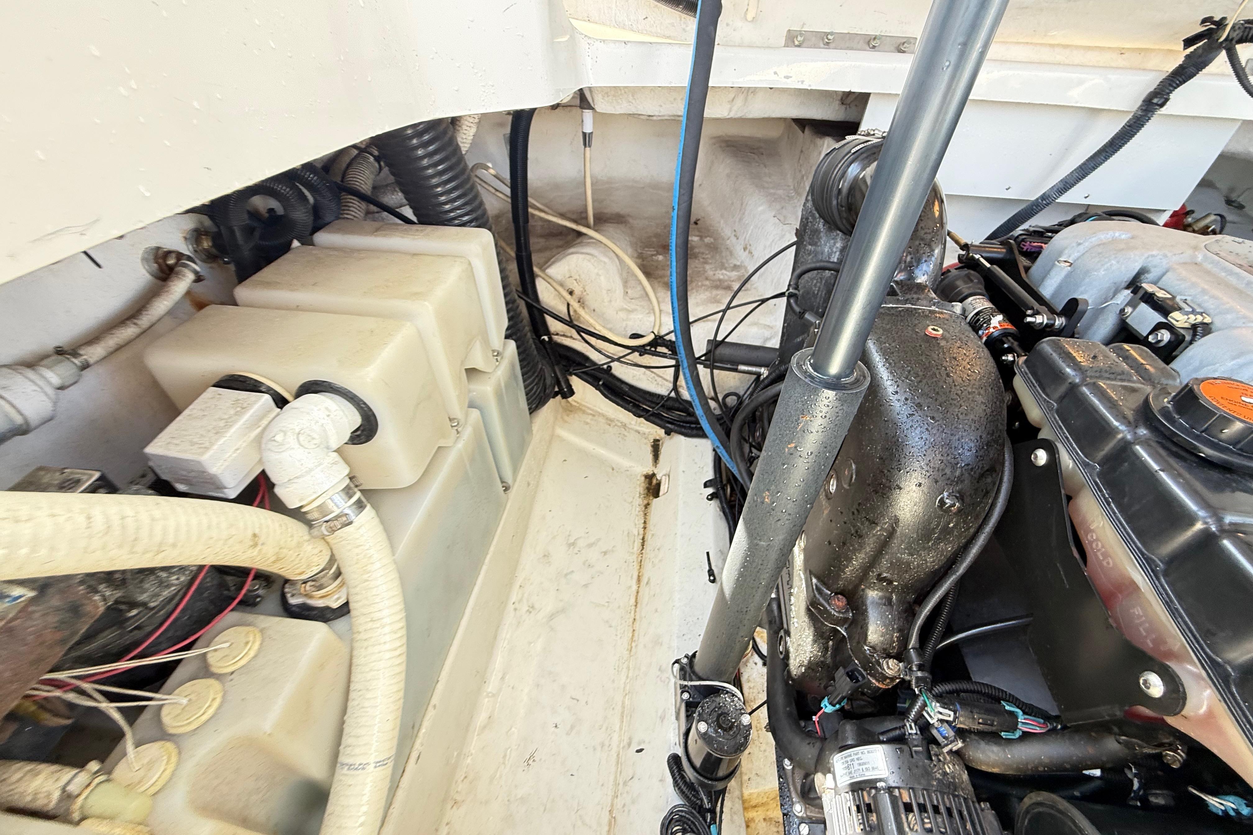 Engine compartment of a 2011 Sea Ray 270 SLX boat, showing mechanical components.