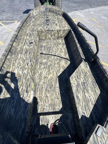 2025 SeaArk 1752 Slayer Pro boat with camouflage interior design.