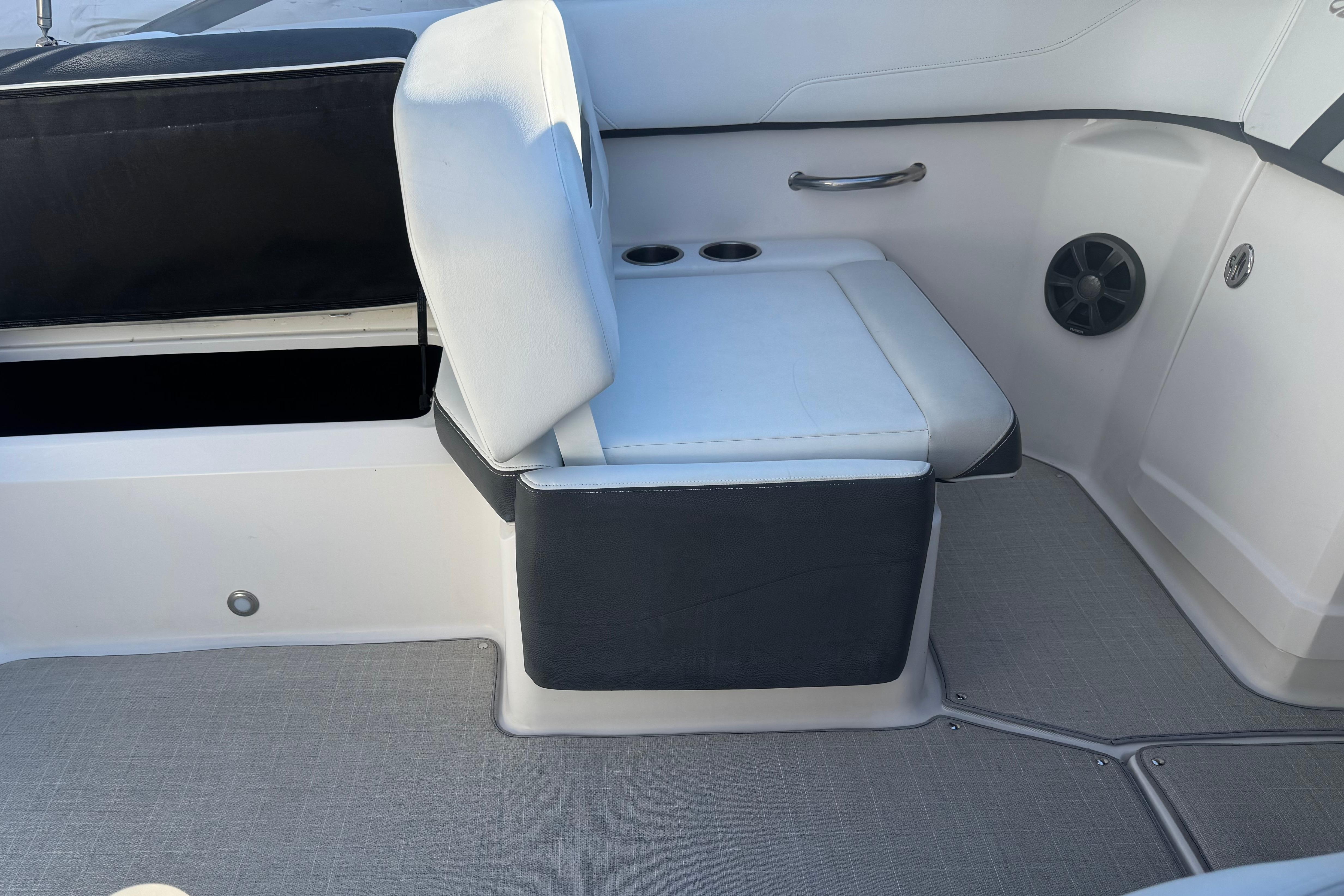 2017 Regal 23 OBX boat interior with white seating and cup holders.