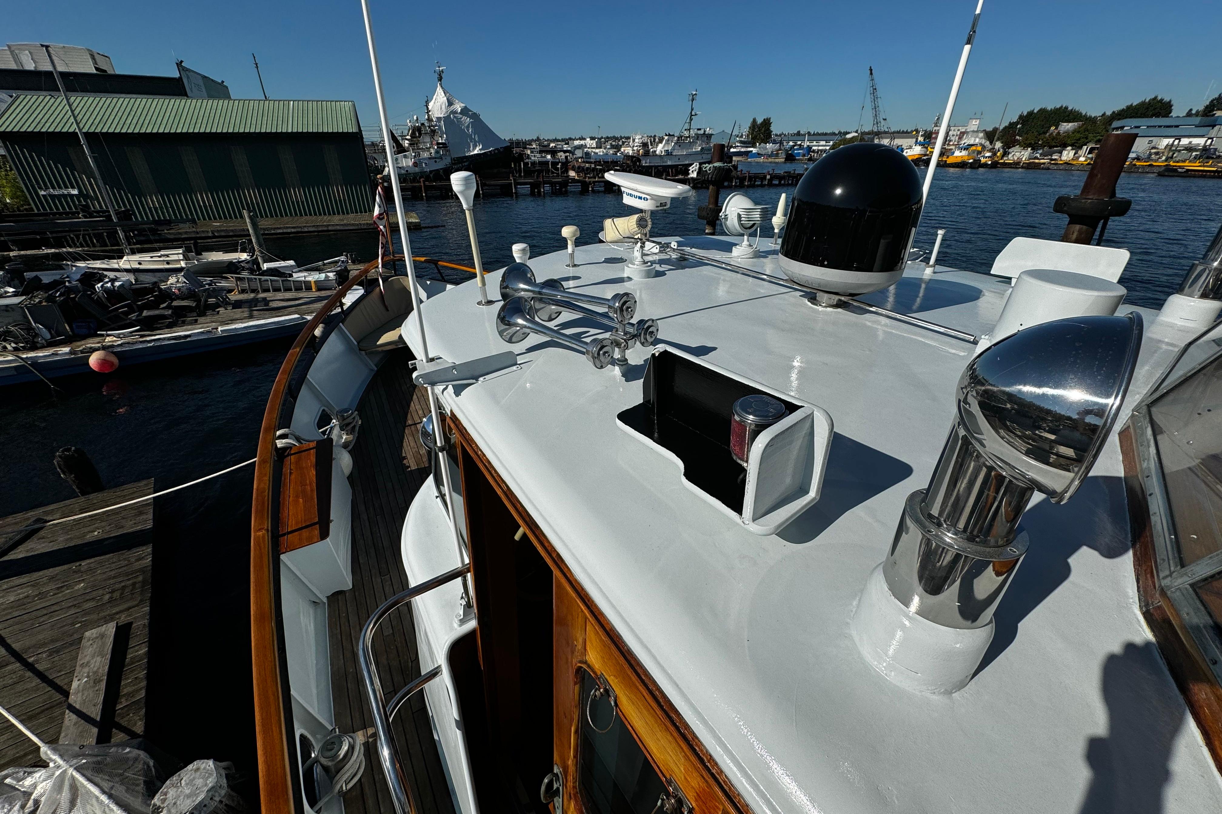 1974 Doggersbank 63 yacht docked at a marina, showcasing its deck and equipment.