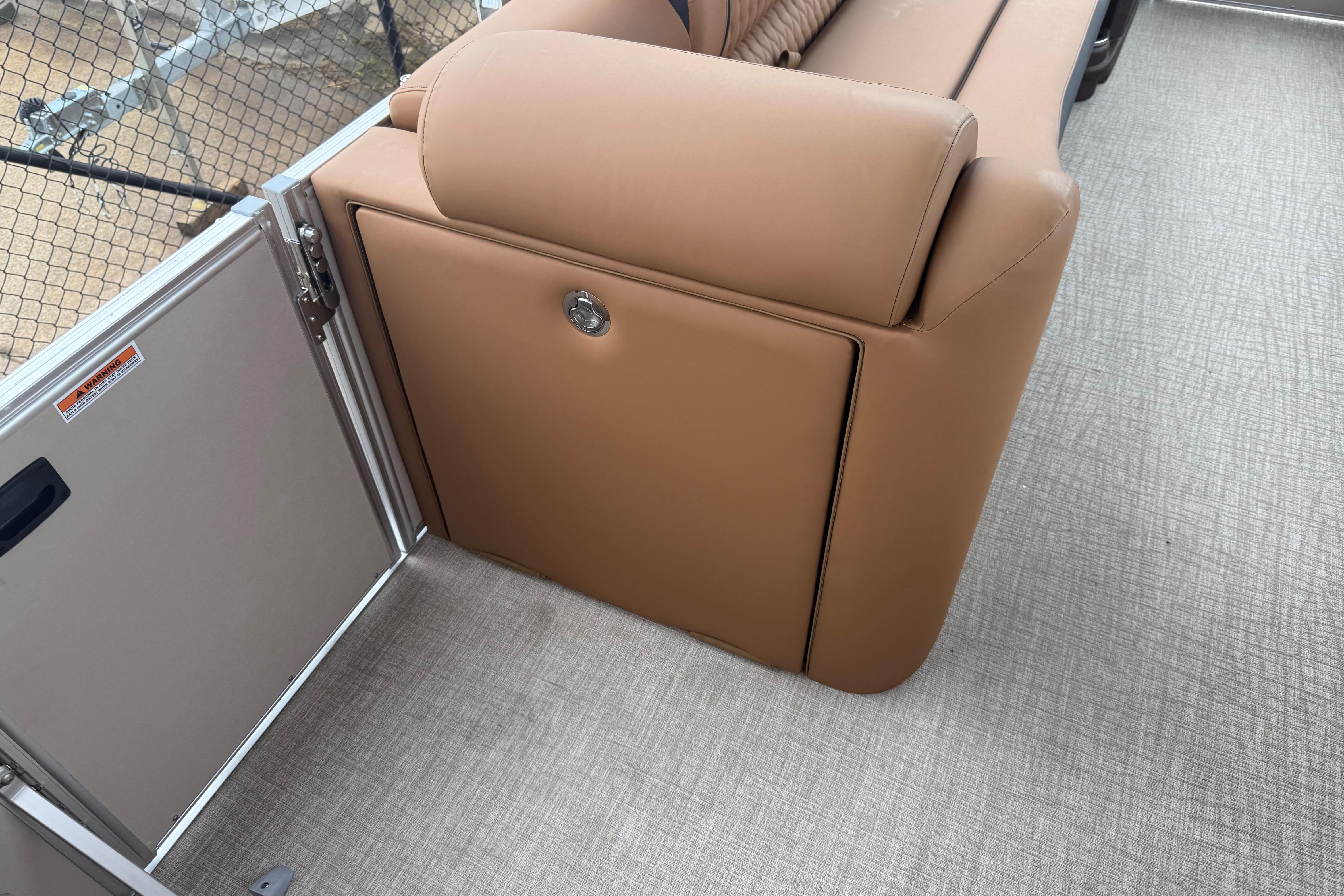 Tan seating on 2026 Avalon Catalina Cruise Funship boat, featuring sleek design and storage compartment.