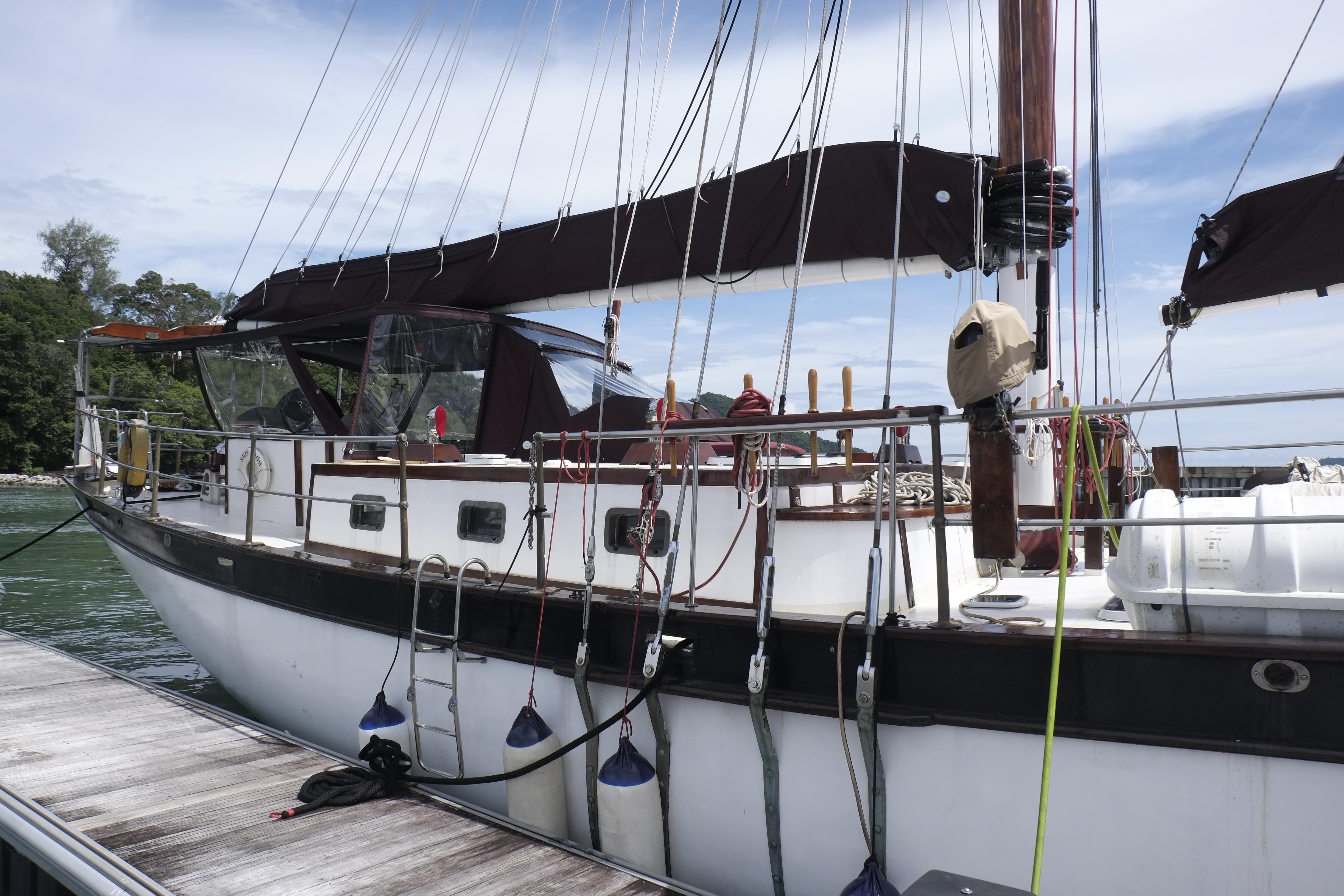 Custom Bud Macintosh schooner, 2006 model, docked at a marina with clear skies.