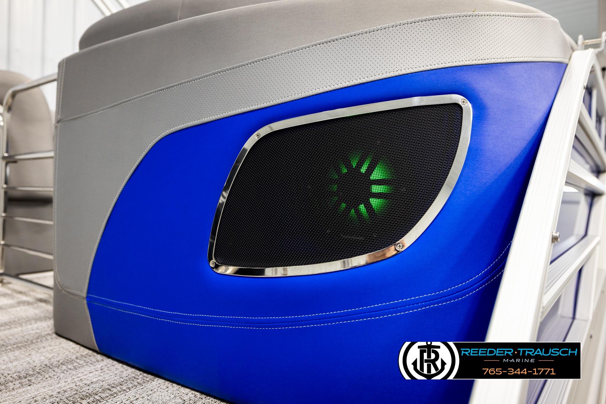 2025 Bennington LTFBSE boat with blue panel and illuminated speaker detail.