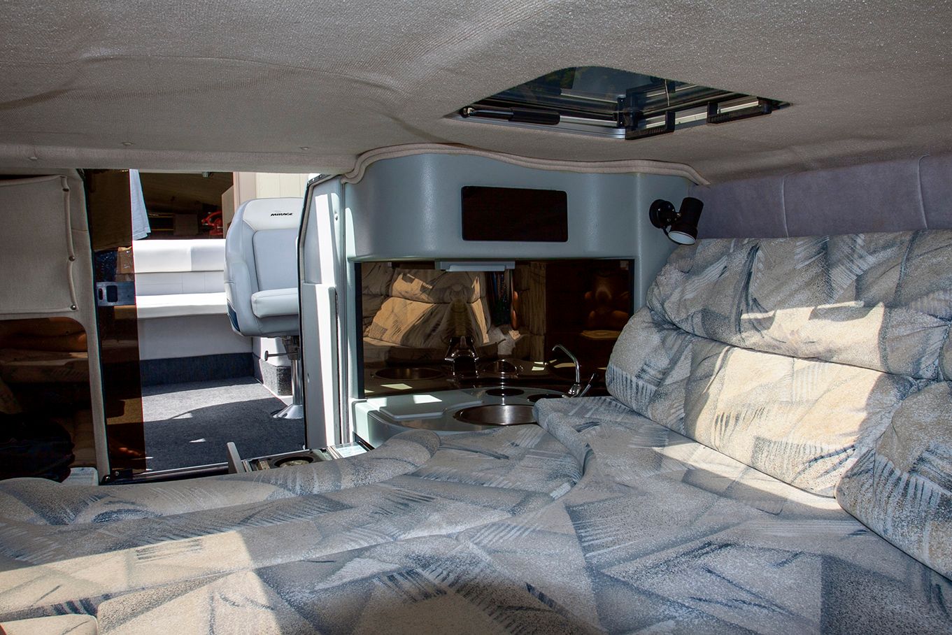 Interior of a 1995 Mirage Trovare 275 boat with sleeping area.
