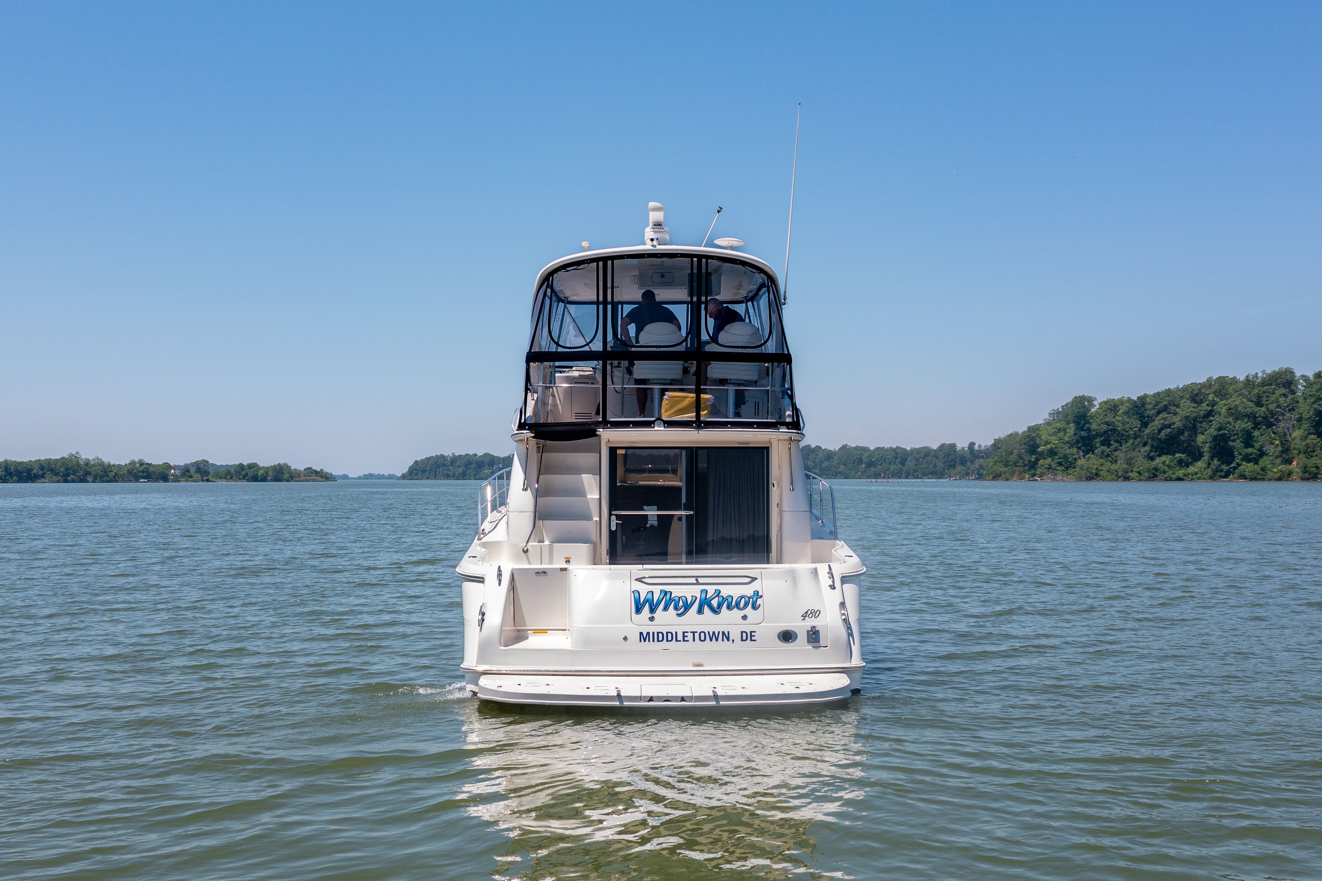2003 Sea Ray 480 Sedan Bridge on calm waters.
