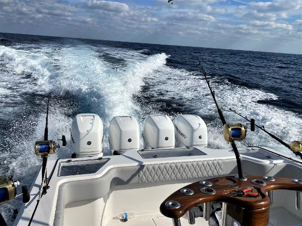 2020 Front Runner 39 Center Console boat cruising with fishing rods and ocean view.